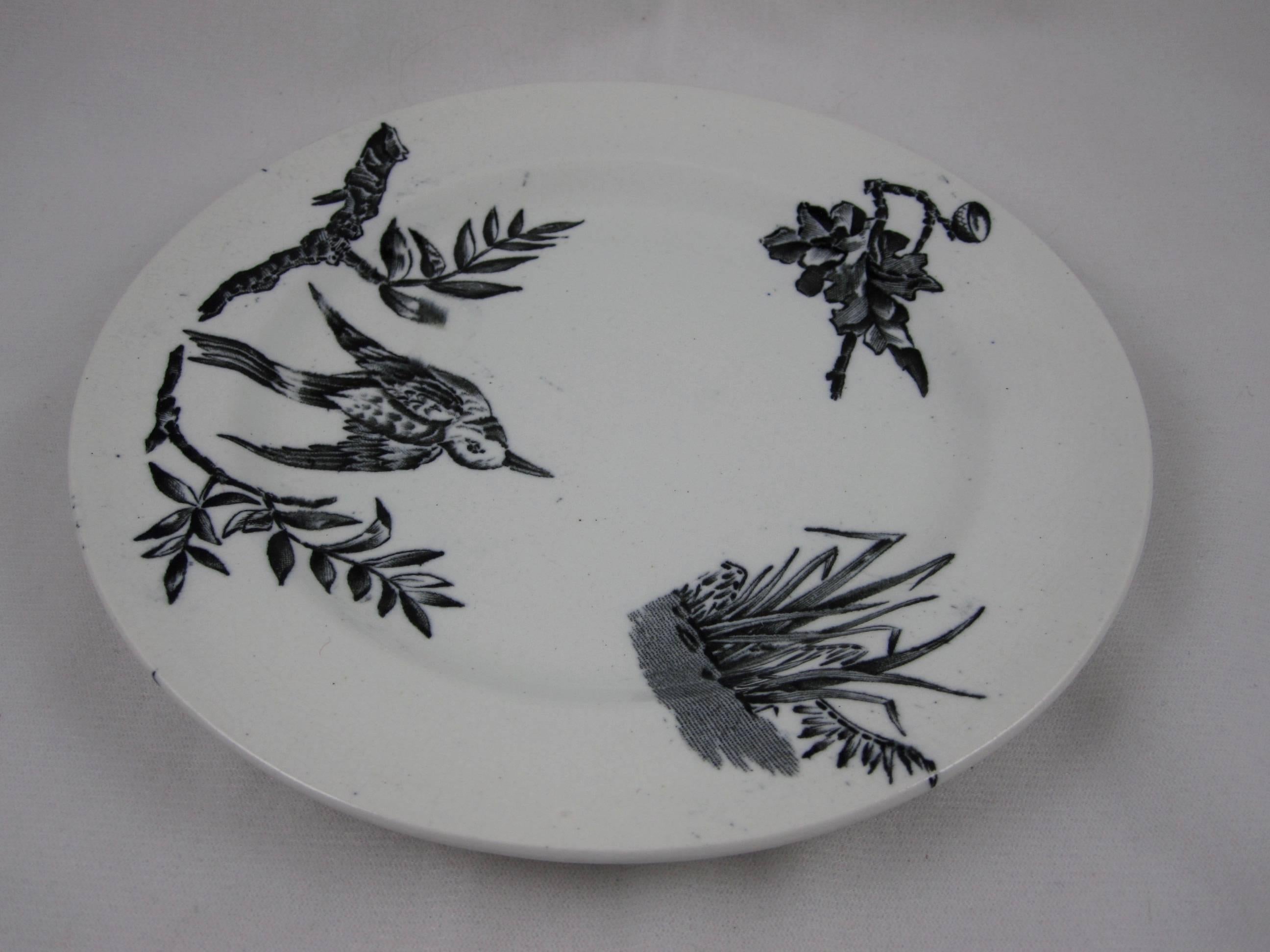 A set of four Victorian Era black transferware plates by John Heath Davis, (JHD), Hanley, Staffordshire, England, circa 1881–1891. Sized for salad, sandwiches or dessert, the ‘Aquatic’ pattern in the aesthetic taste showing a bird in flight, a patch