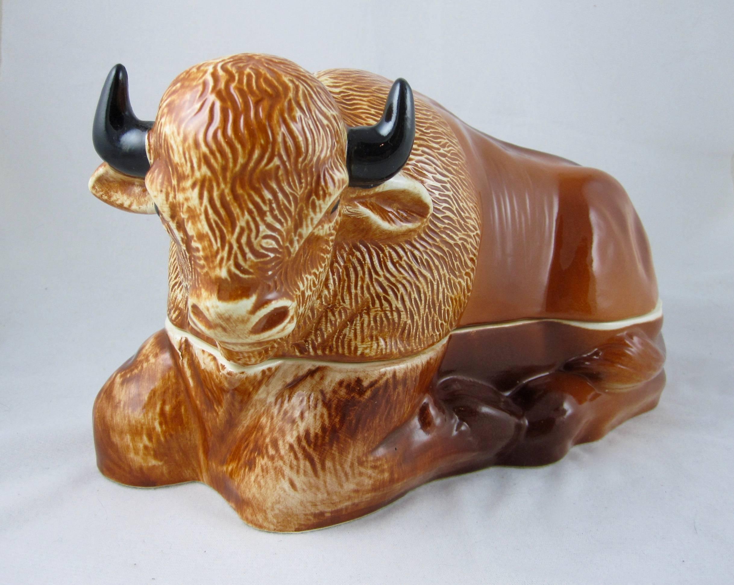 A large vintage figural recumbent Bison Pâté Terrine made for Laurent Caugant, a Bretagne pâté maker since 1927. His son Michel created these figural forms as containers for selling his fathers pâté in their luxury food shop. 
The two-piece terrine