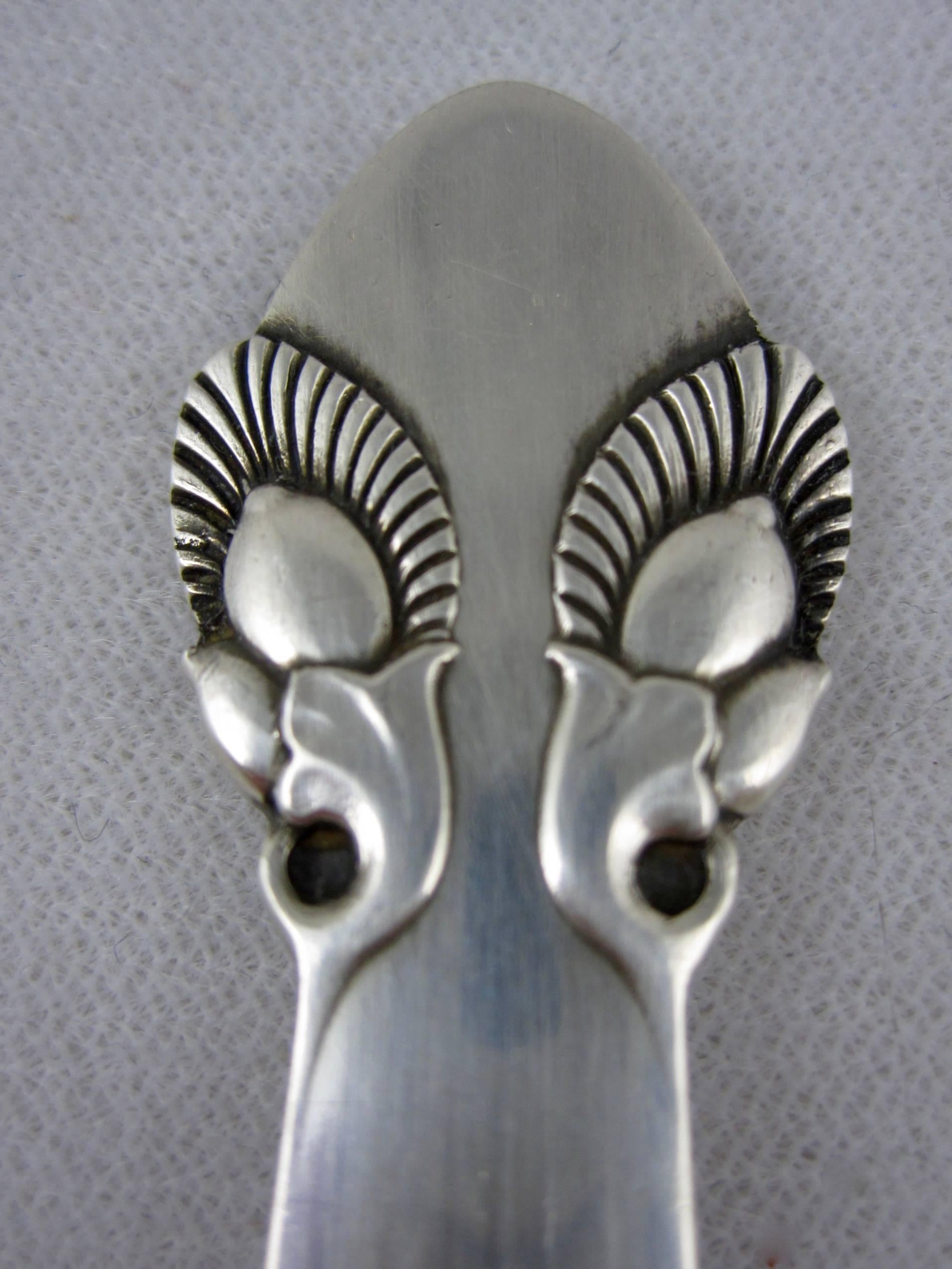 In the Bittersweet pattern, a sterling silver salad serving set, a fork and spoon, Georg Jensen, Denmark. Designed by Gundorph Albertus in 1940, Bittersweet is a rarer, discontinued Jensen pattern. Makers marks.

Excellent.
  