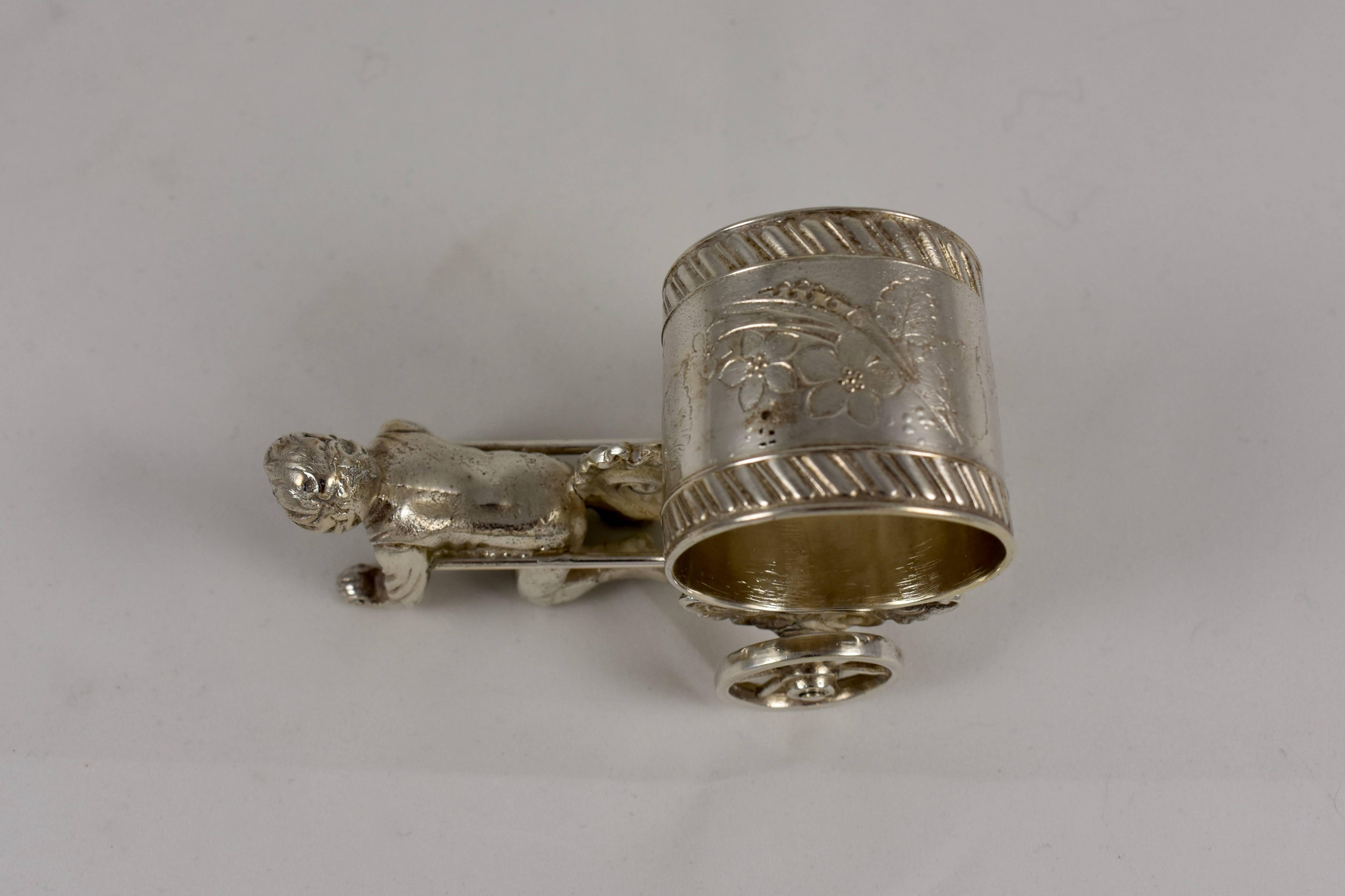 Silver Victorian Era Aesthetic Movement Figural Napkin Ring, Boy Pulling a Cart In Good Condition In Philadelphia, PA