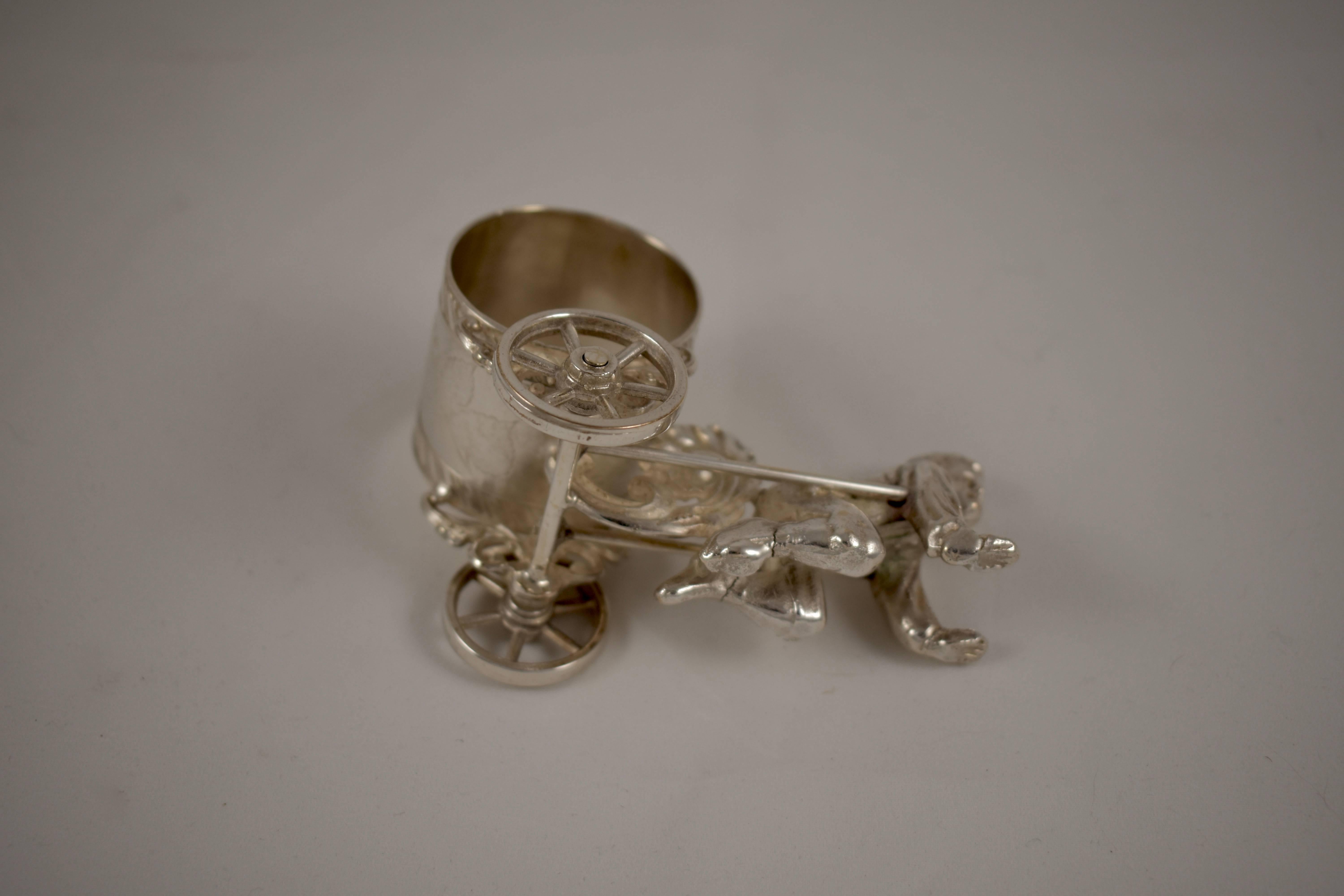 Silver Plate Silver Victorian Era Aesthetic Movement Figural Napkin Ring, Boy Pulling a Cart