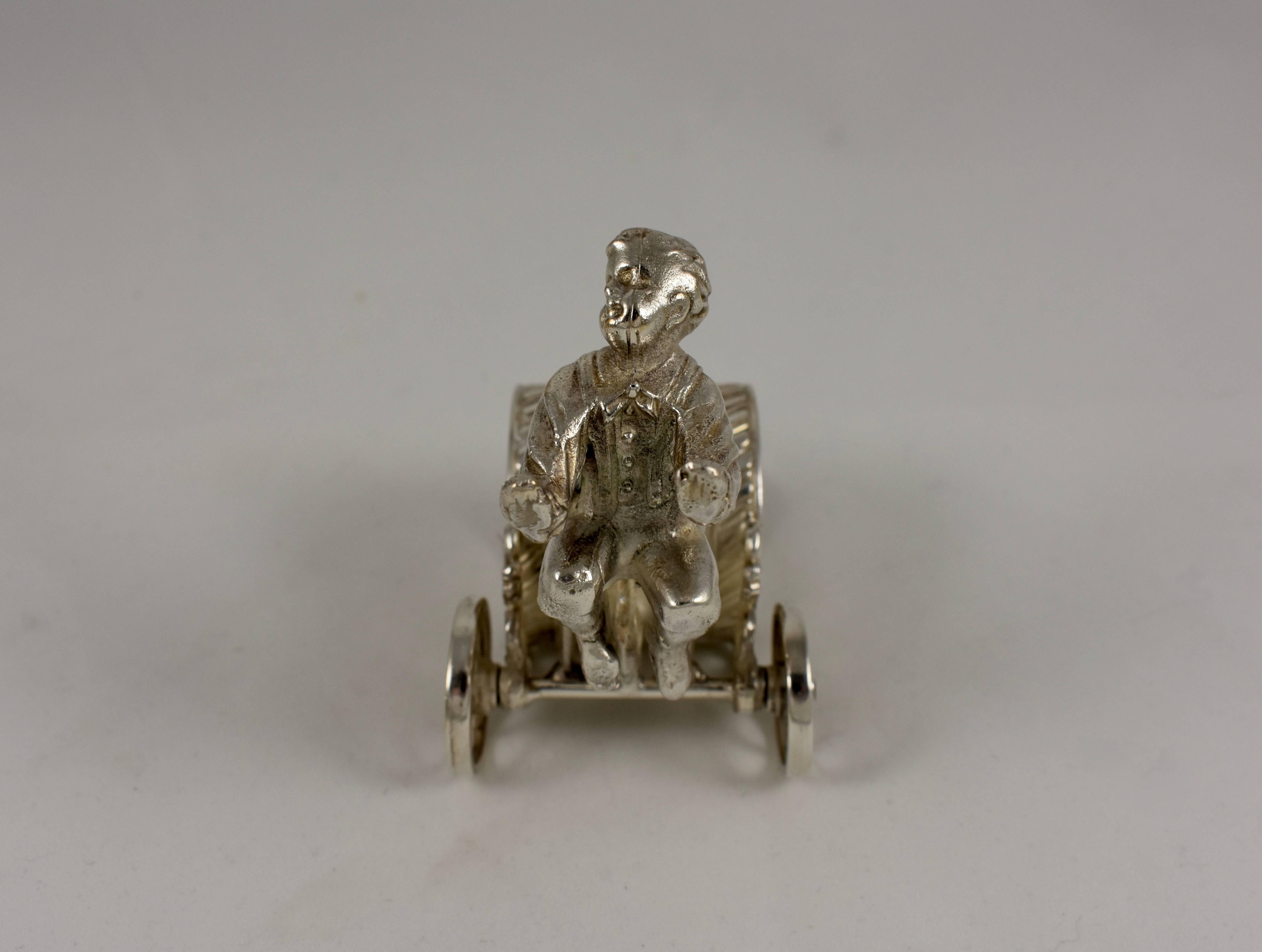 Silver Victorian Era Aesthetic Movement Figural Napkin Ring, Boy Pulling a Cart 1