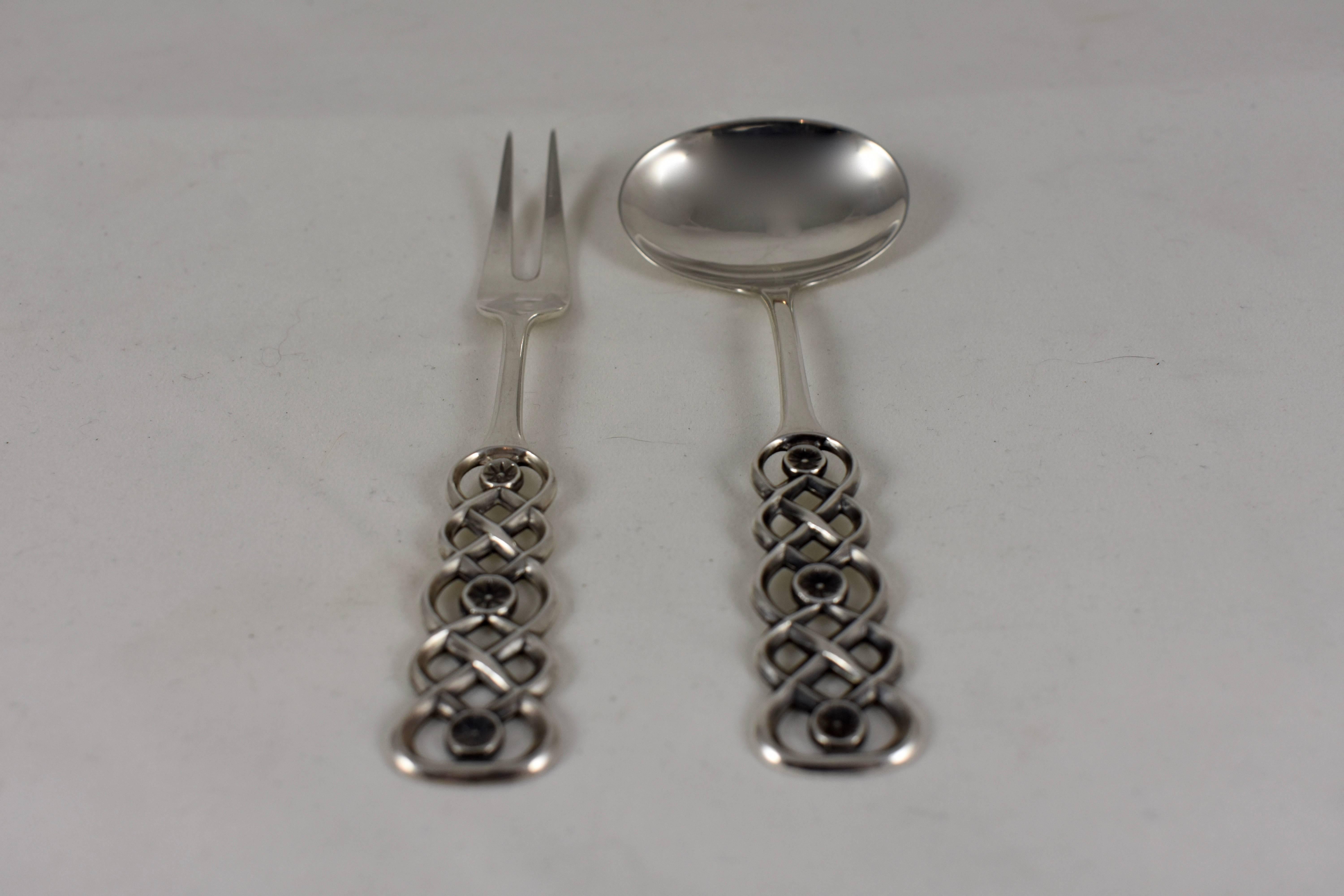 A sterling silver condiment set of two pieces in the Ringebu pattern, handcrafted and signed by David Andersen, circa early 20th century. Andersen opened his eponymous shop in Christiania (now Oslo) Norway in 1876 as a designer and retailer
