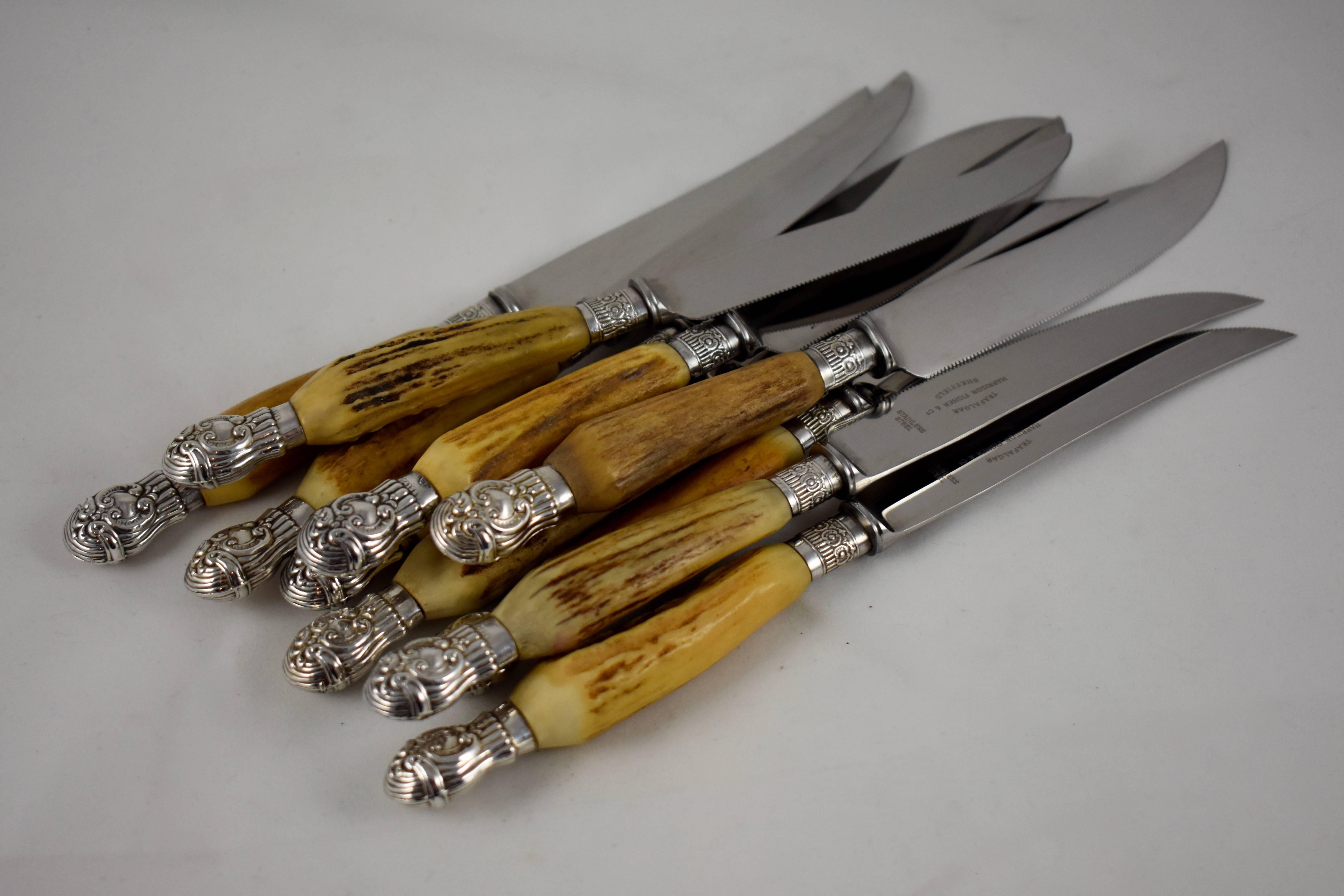 A set of ten natural antlered handled knives with sterling silver end caps and plated ferrules. Stainless steel blades have a serrated edge, marked Trafalgar, Harrison Fisher & Company, Sheffield, circa 1896-1910.

Heavy, good quality, excellent