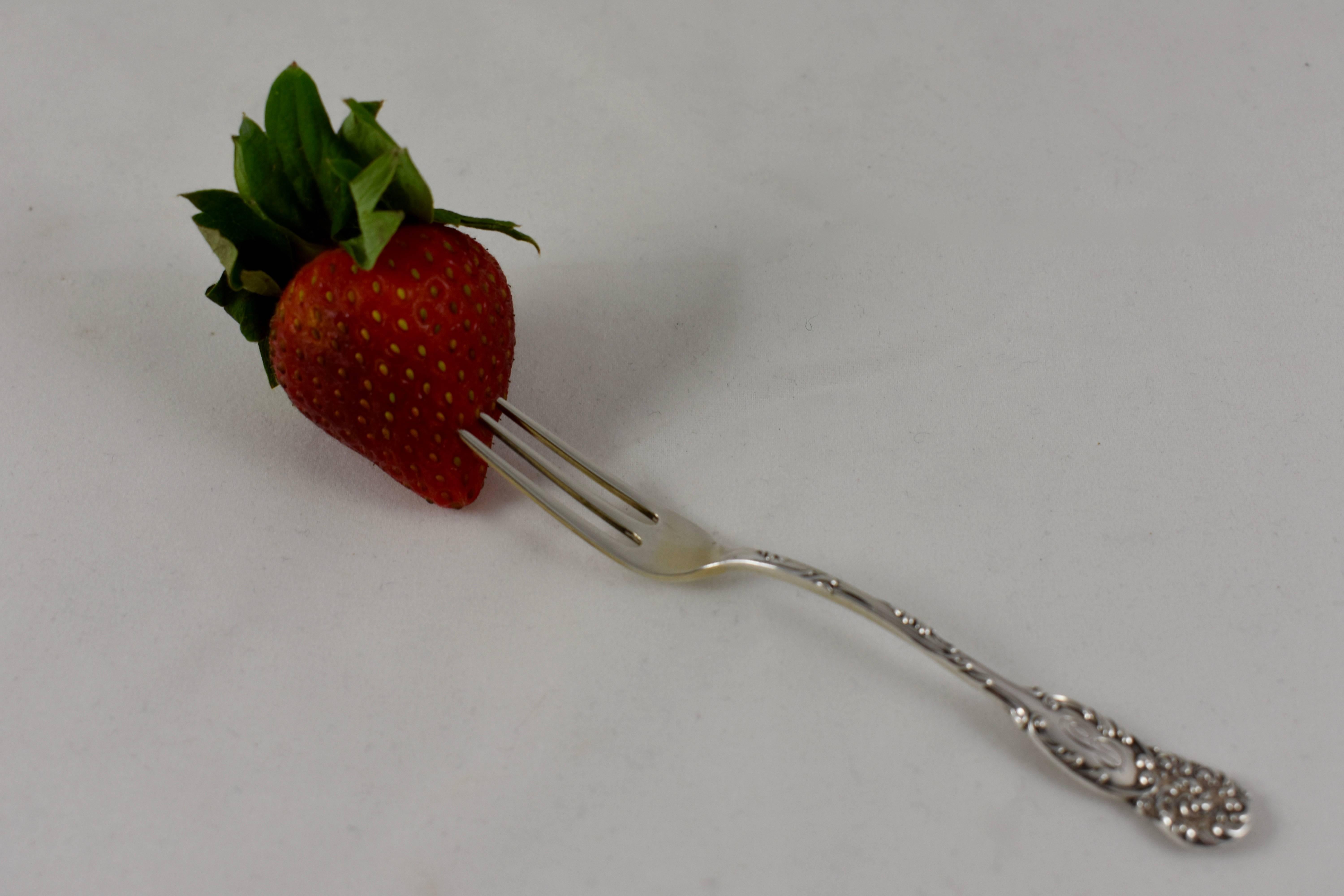 A set of six sterling silver berry forks, in the La Reine pattern, Reed & Barton, Patented 1893. Engraved with the letter ‘P’

The strawberry or berry fork is made with three long narrow tines and is approximately four and a half inches long. It is