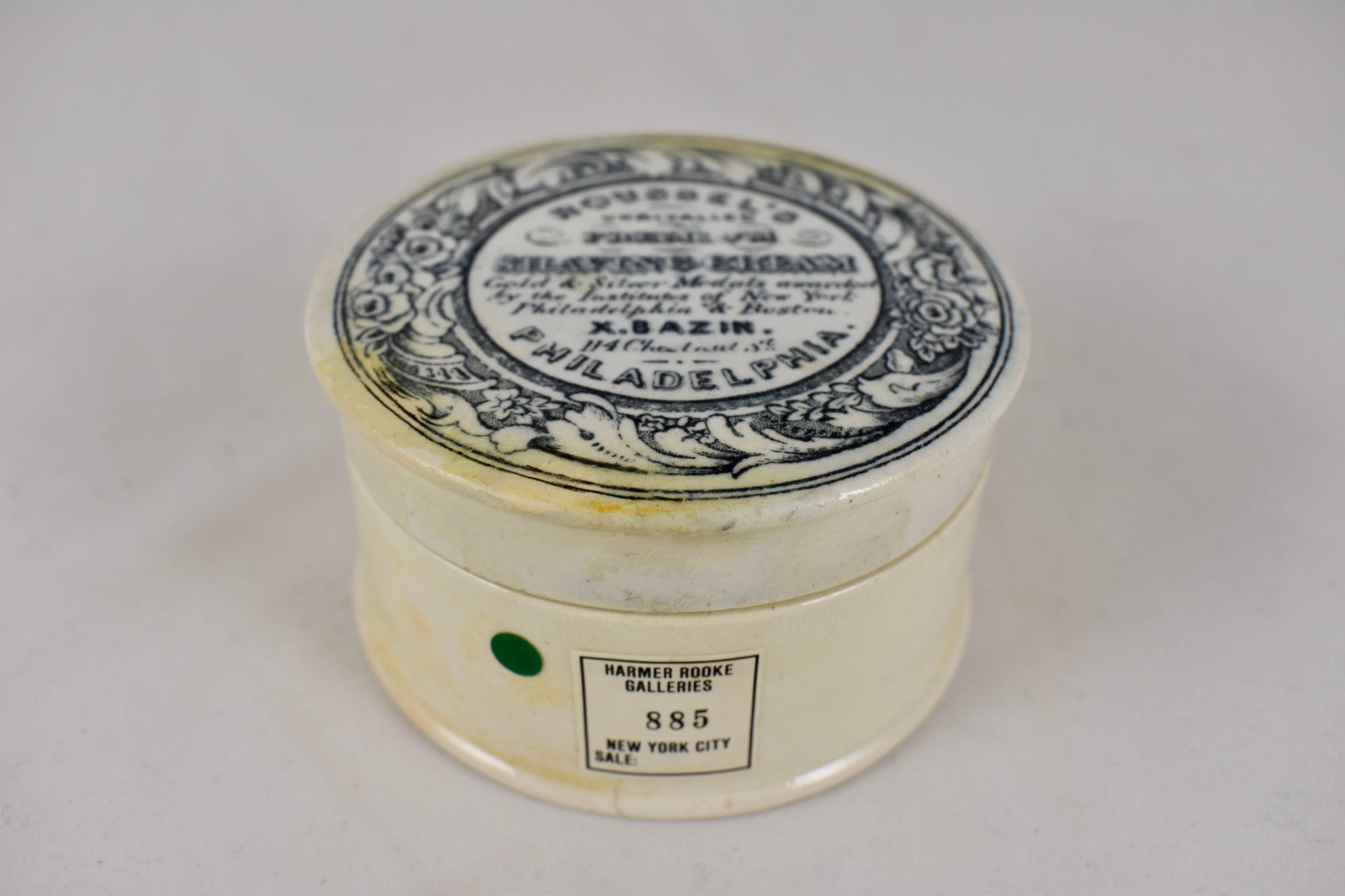 A transfer printed covered ceramic earthenware container from the Victorian Era, made in England for a popular Philadelphia perfumery, circa 1845.

The black transfer reads: Roussels unrivaled Premium Shaving Cream. Gold & Silver Medals awarded by