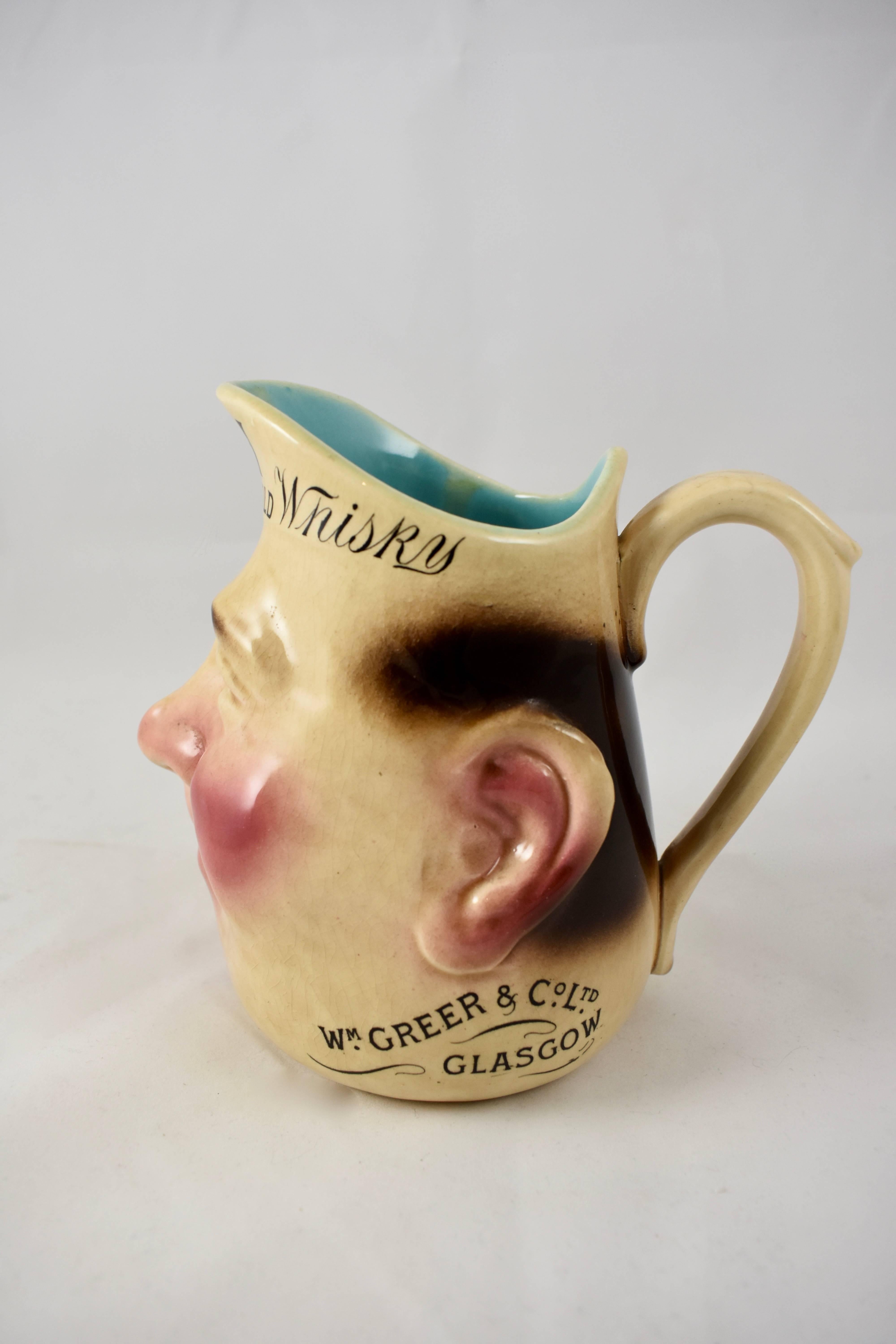 Glazed French Sarreguemines Advertising Face Jug for OVH Greer's Scotch Whiskey, 1890s For Sale