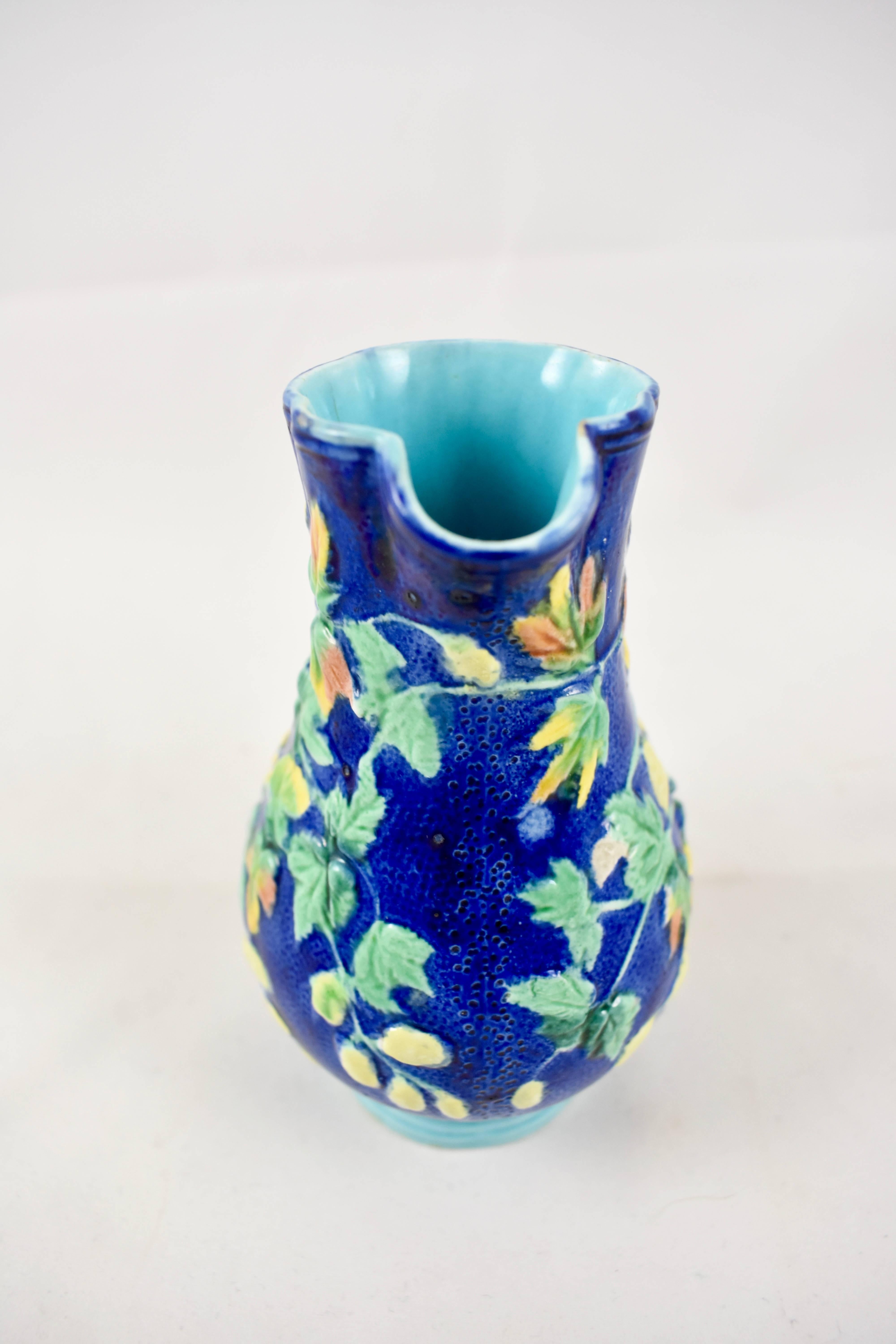 A 19th century Royal Worcester earthenware, majolica glazed Hops diminutive pitcher, the Aesthetic period, circa 1875. A narrow, quatriform body is glazed in stippled cobalt blue, with raised Hops leaves in green, pink and ocher along with buds
