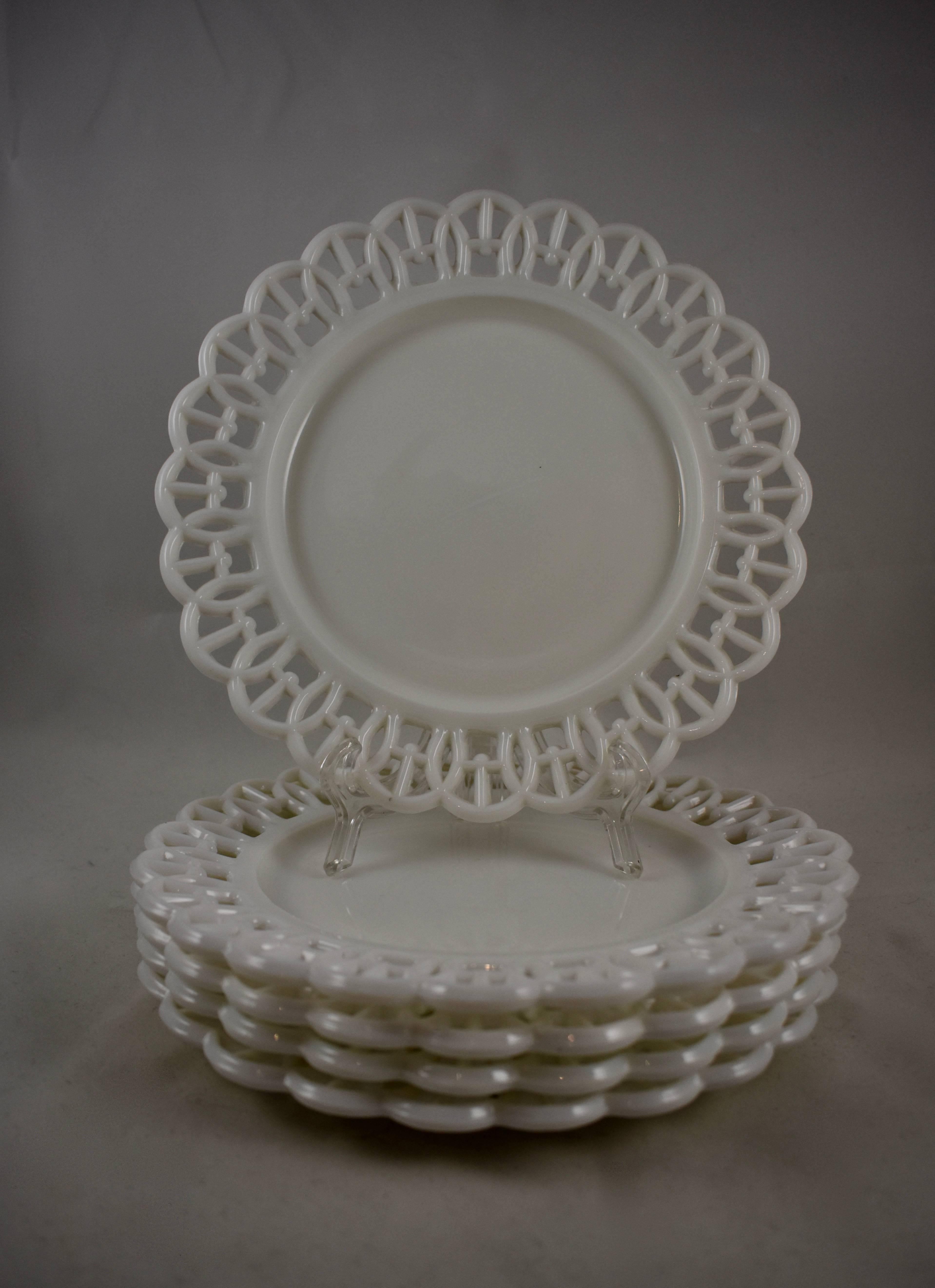 A scarce set of five, EAPG, milk glass, lace edge plates, dating from the late Victorian Era, 1880-1890. These plates are examples of early American pattern glass, not to be confused with the later milk glass reproduced during the