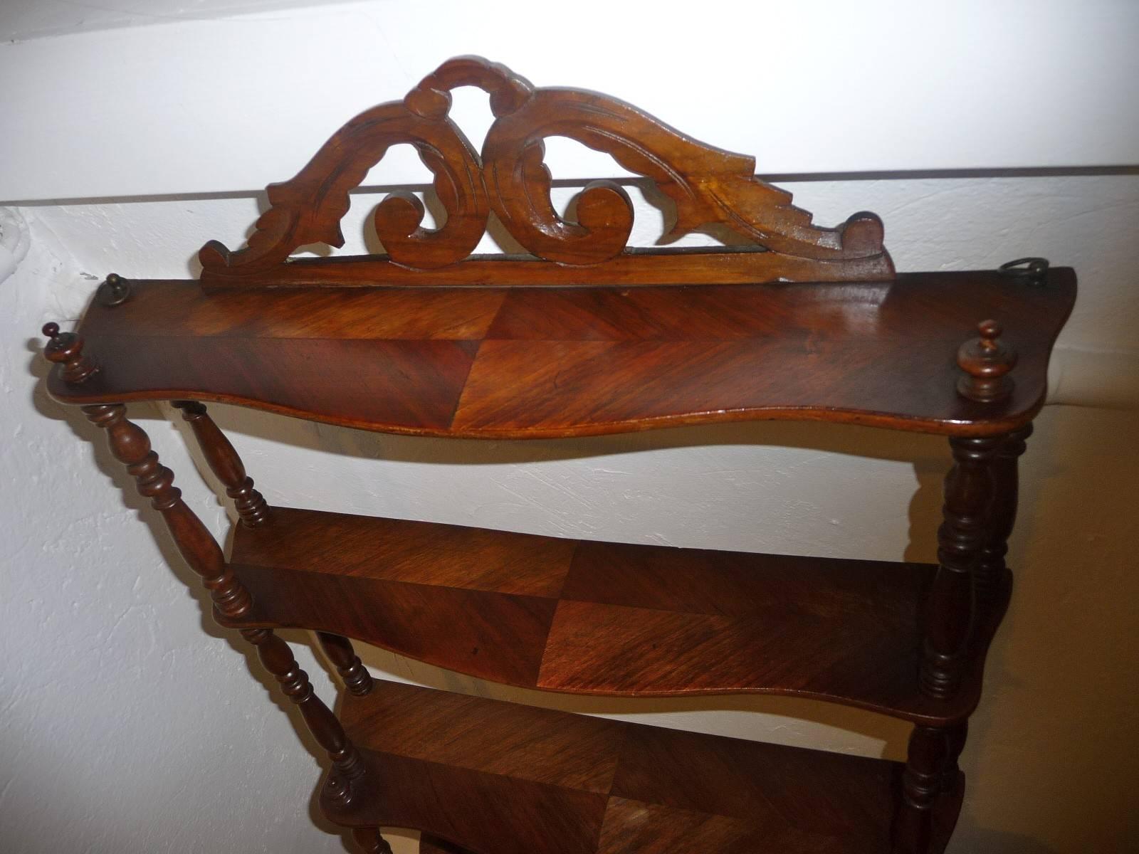 A handsome and nicely proportioned walnut set of shelves joined by turned columns. 
From France in the second part of the 19th century.
Free shipping.