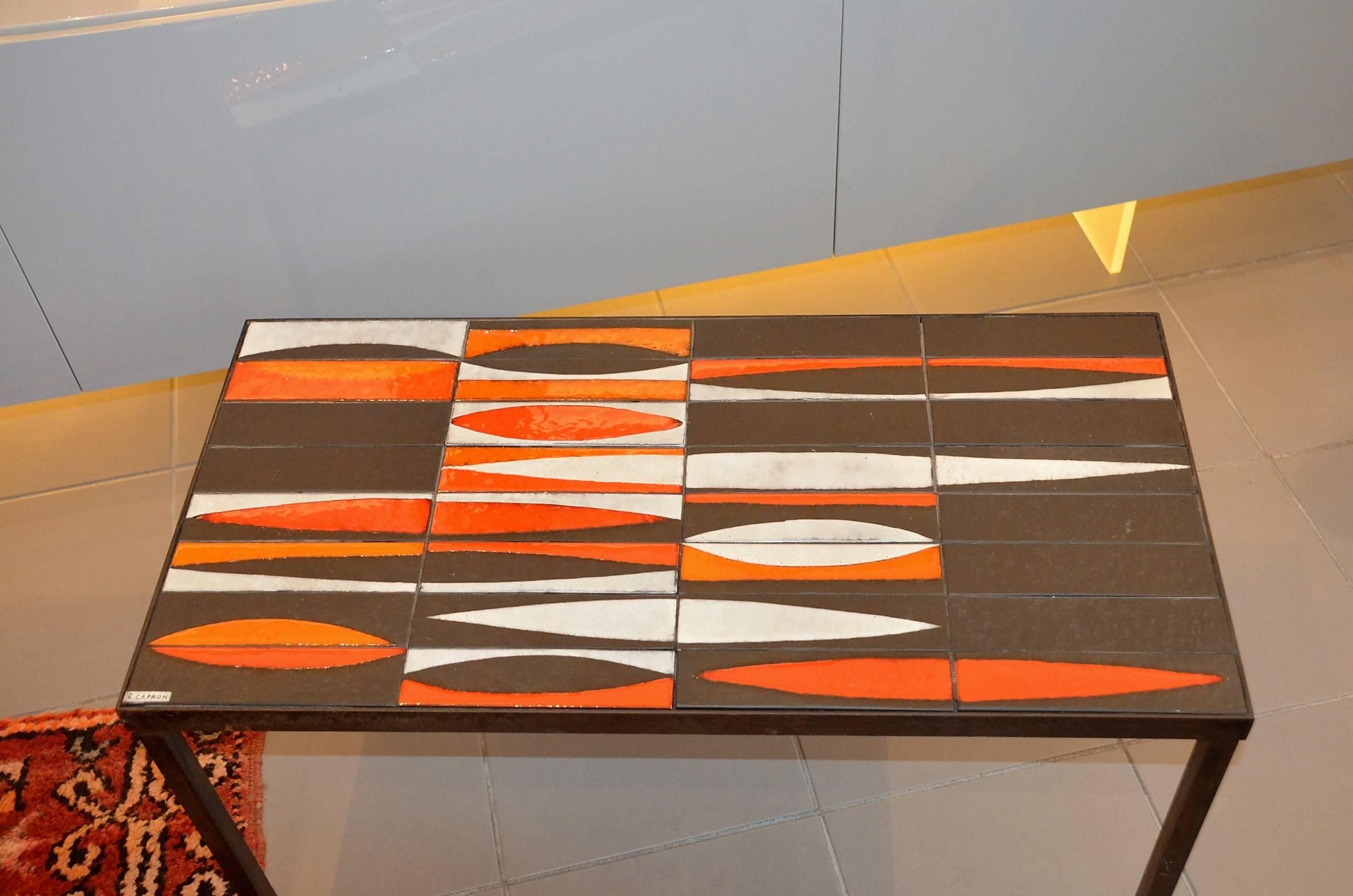 Coffee table signed by Roger Capron of 1950s. Structure black lacquered metal, ceramic tray. Signature on the board.
 
