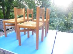 Set of Four Charlotte Perriand Oak Chairs for Méribel, circa 1950