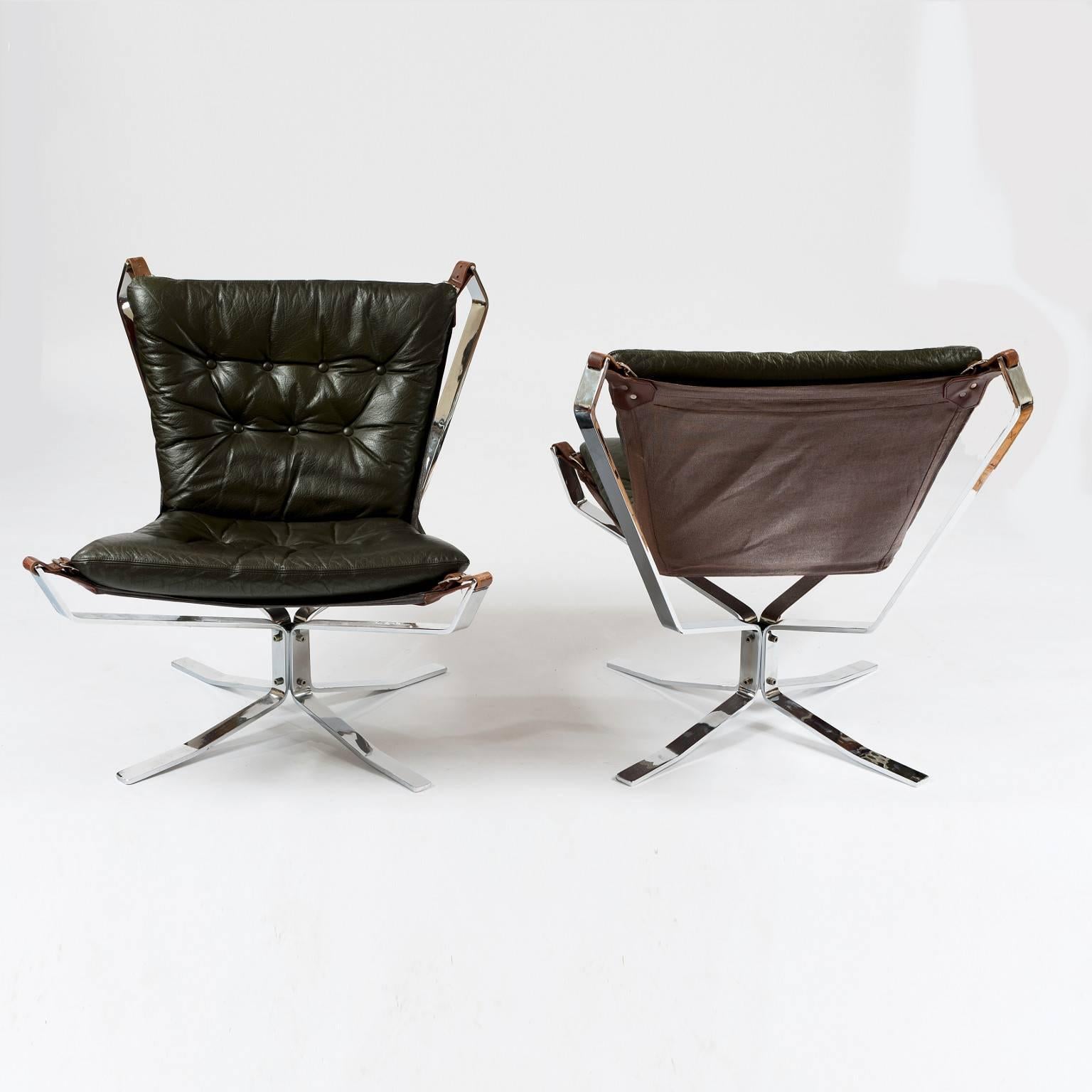 This is an original pair of chrome and leather low back lounge chairs produced in the 1970s by a Dansk Mobelfabrik Producent.

Similar to the Sigurd Ressell Falcon chair they feature a hammock-like experience as the canvas sling is attached to the