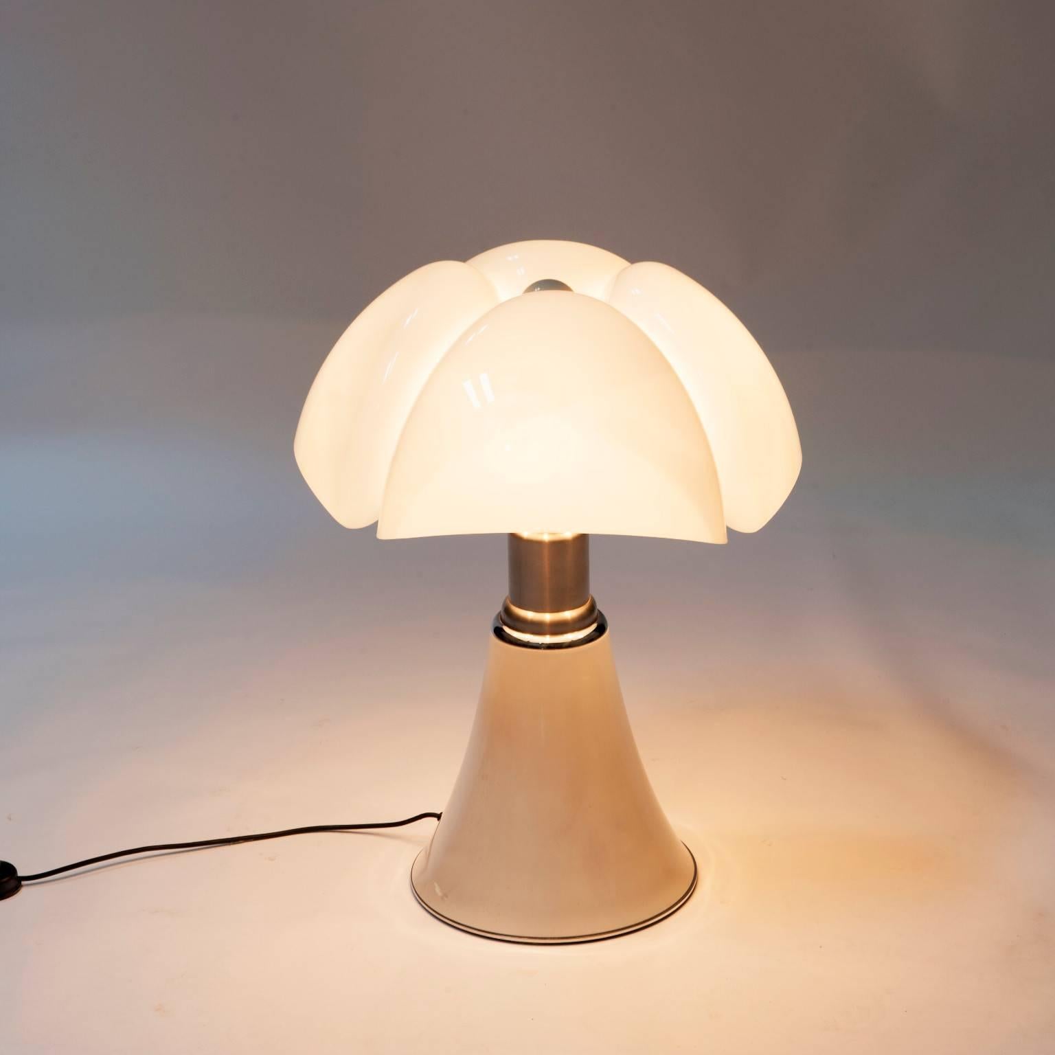 The Pipistrello table lamp was designed by Gae Aulenti for Martinelli Luce in 1965. 