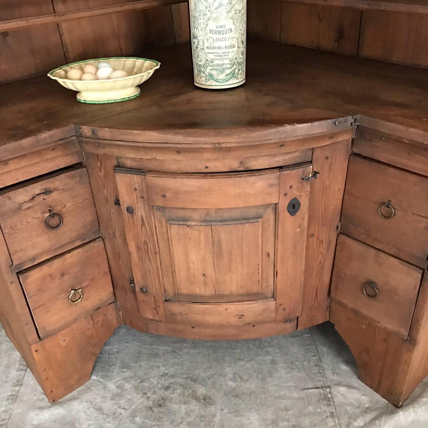 Very unusual 19th century Swedish corner cabinet, open front. Shelves behind door, four drawers, plate rack and spoon shelf at the upper part. Two parts.