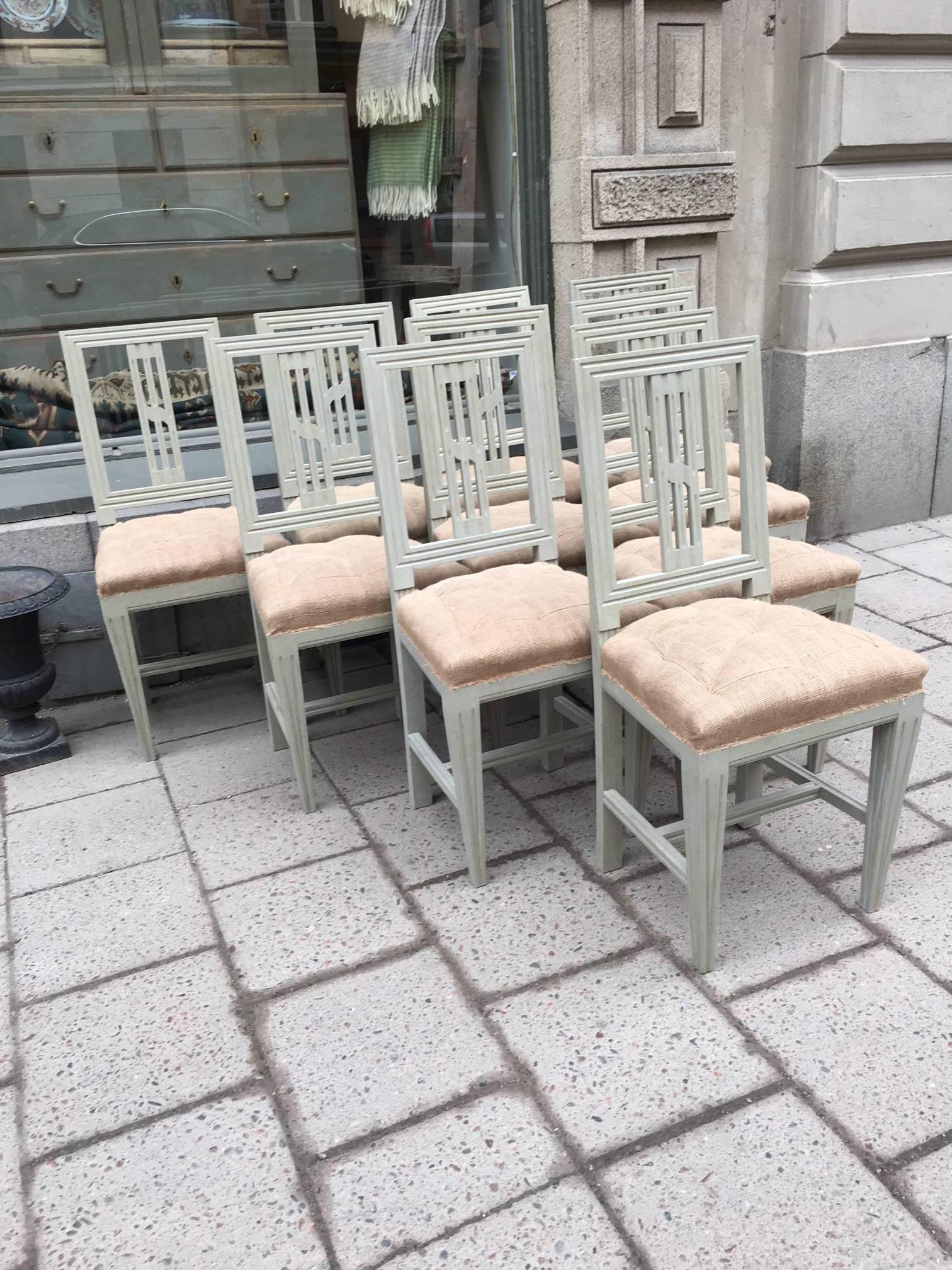 Set of ten Swedish Gustavian style chairs, late 19th century. Gray/green painting, upholstered with servant, seats with saddel-girth. Very solid and in perfect condition.
