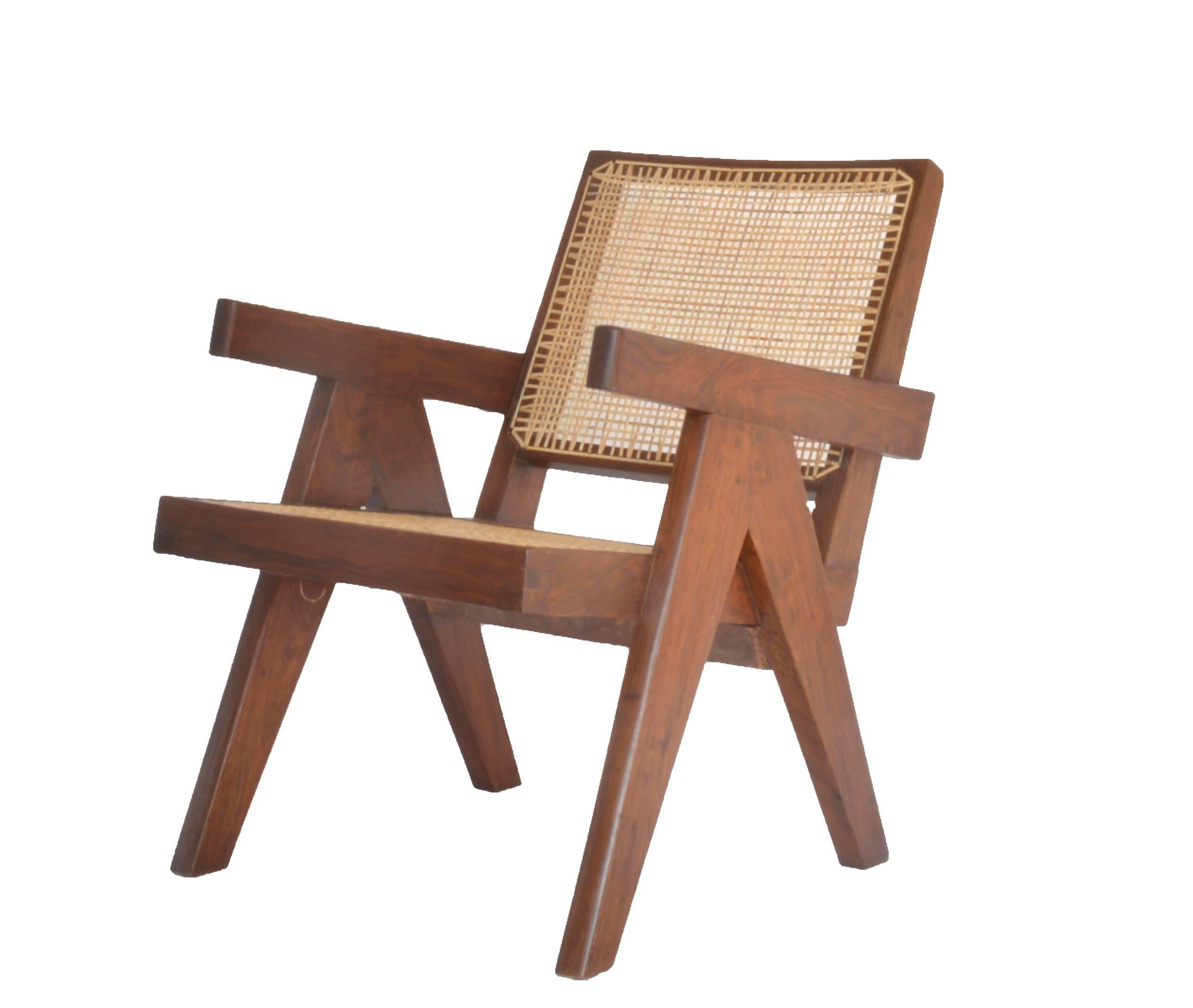 Lounge chair designed by Pierre Jeanneret in bleached teak with cane back and seat. 