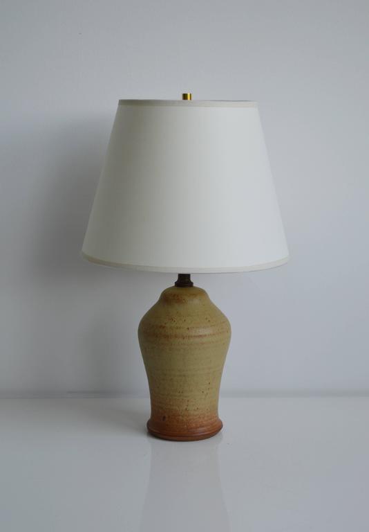 Vintage Studio Pottery lamp with brass harp and finial. Shade included.

Offered by Neal Beckstedt