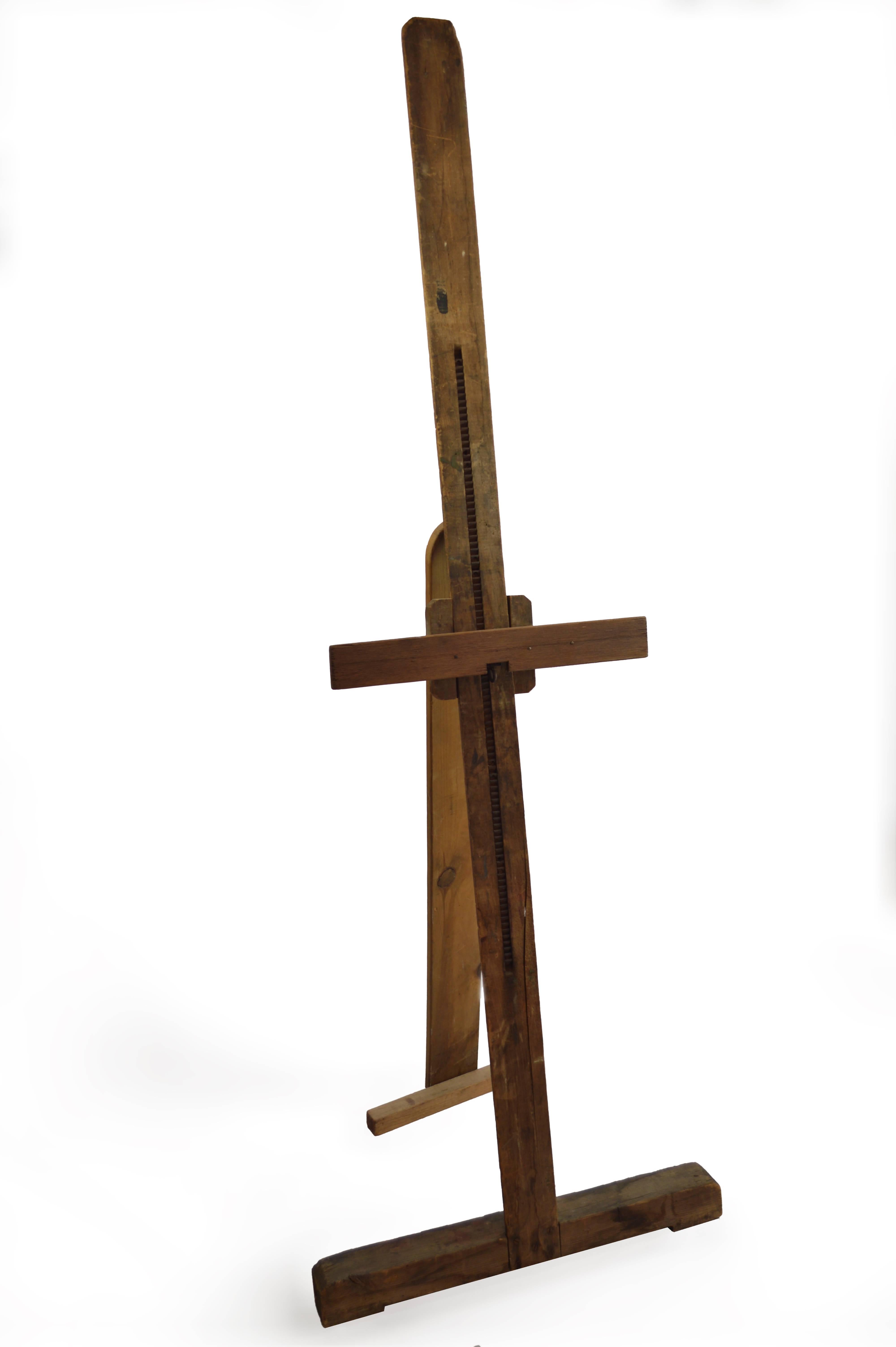 Vintage adjustable artist's easel can be used to display artwork, or as a decorative piece. The crossbar of the easel can be adjusted to your preferred height.