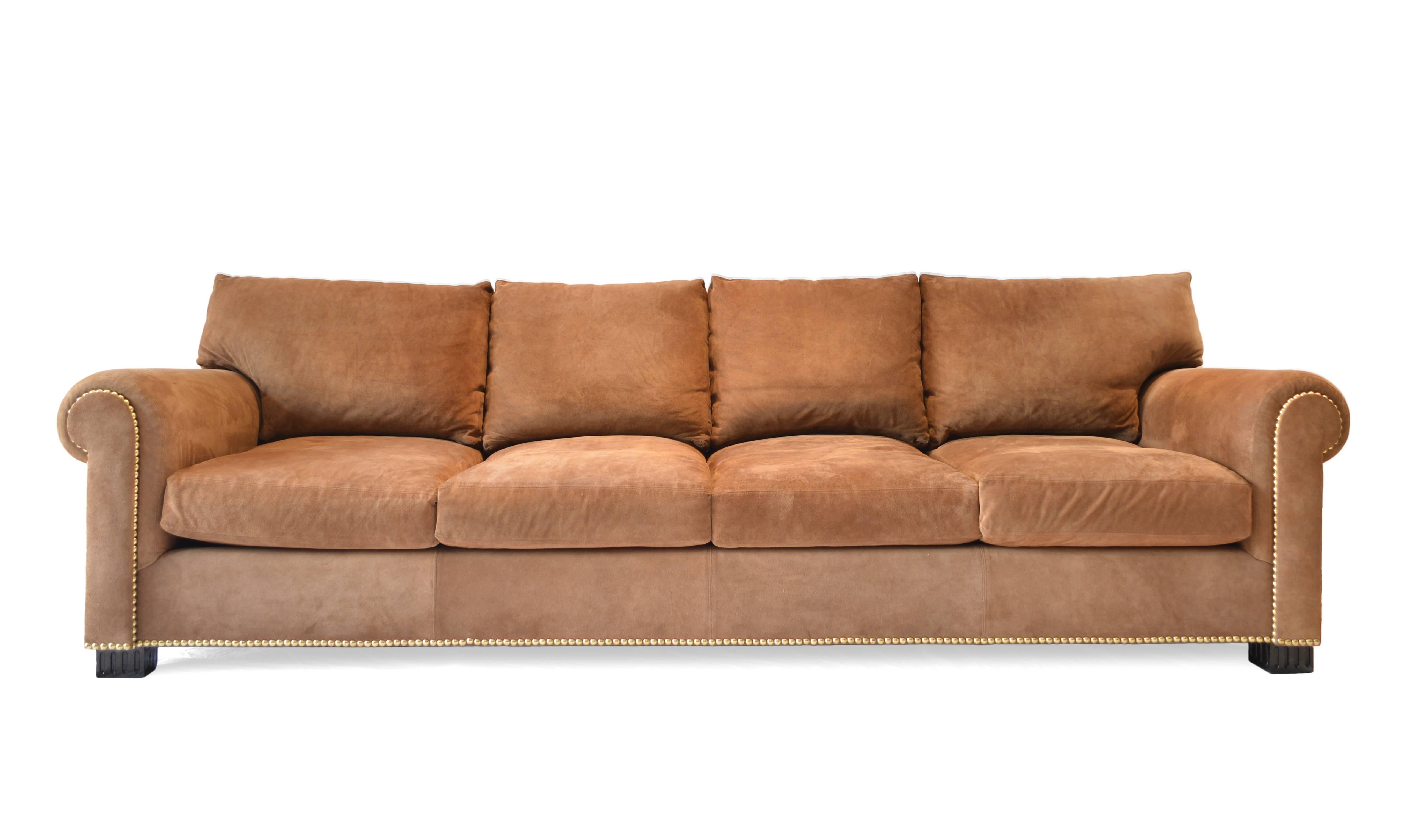 Tan suede sofa with deep comfortable seats and nailhead trim detailing. Made by Ralph Lauren.