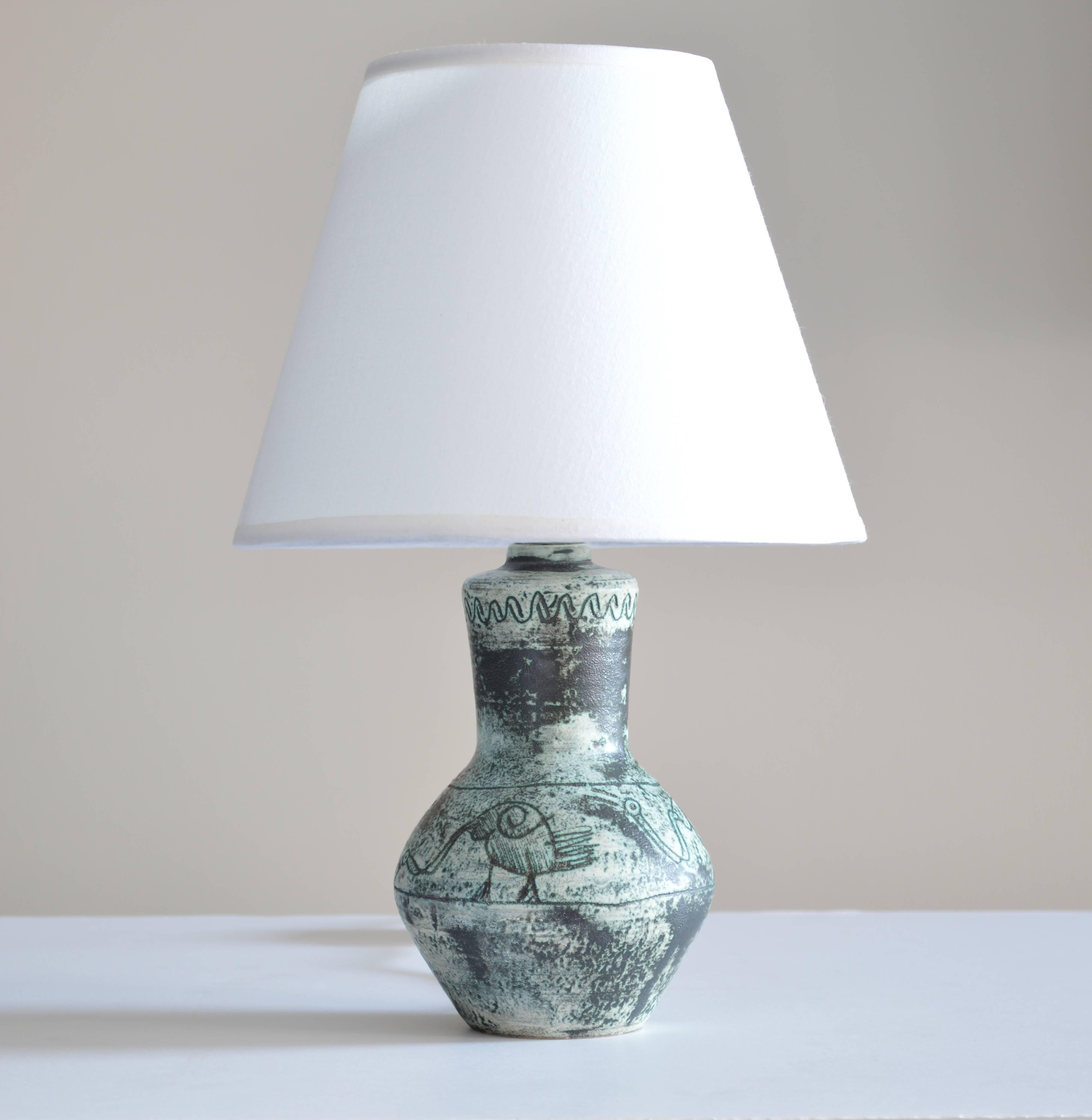 Petite Jacques Blin table lamp with mottled glaze and decorative etchings. Base diameter is 2.5