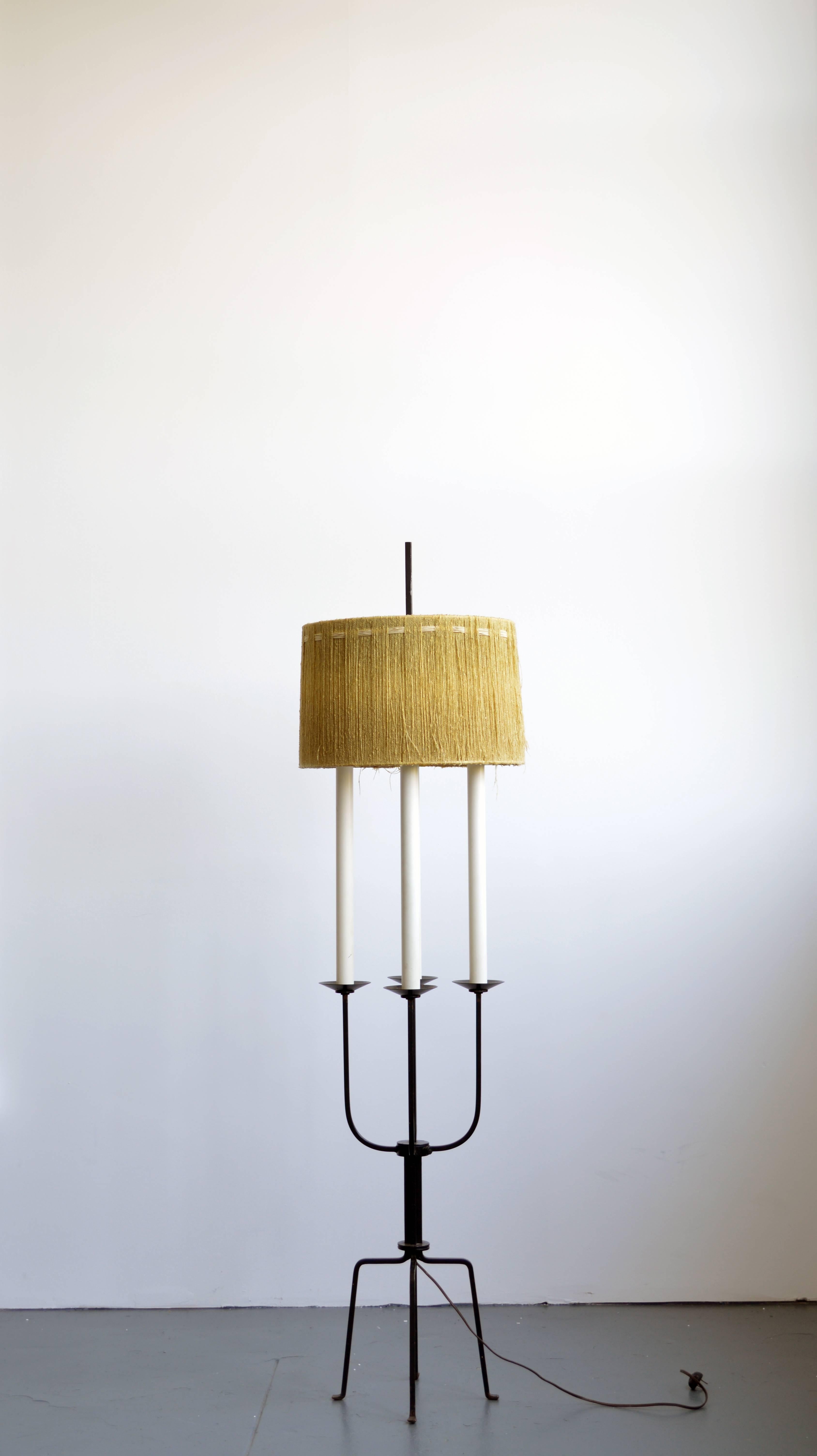 Wrought iron floor lamp designed by Tommi Parzinger. The wool shade is a rare original.

Offered by Neal Beckstedt