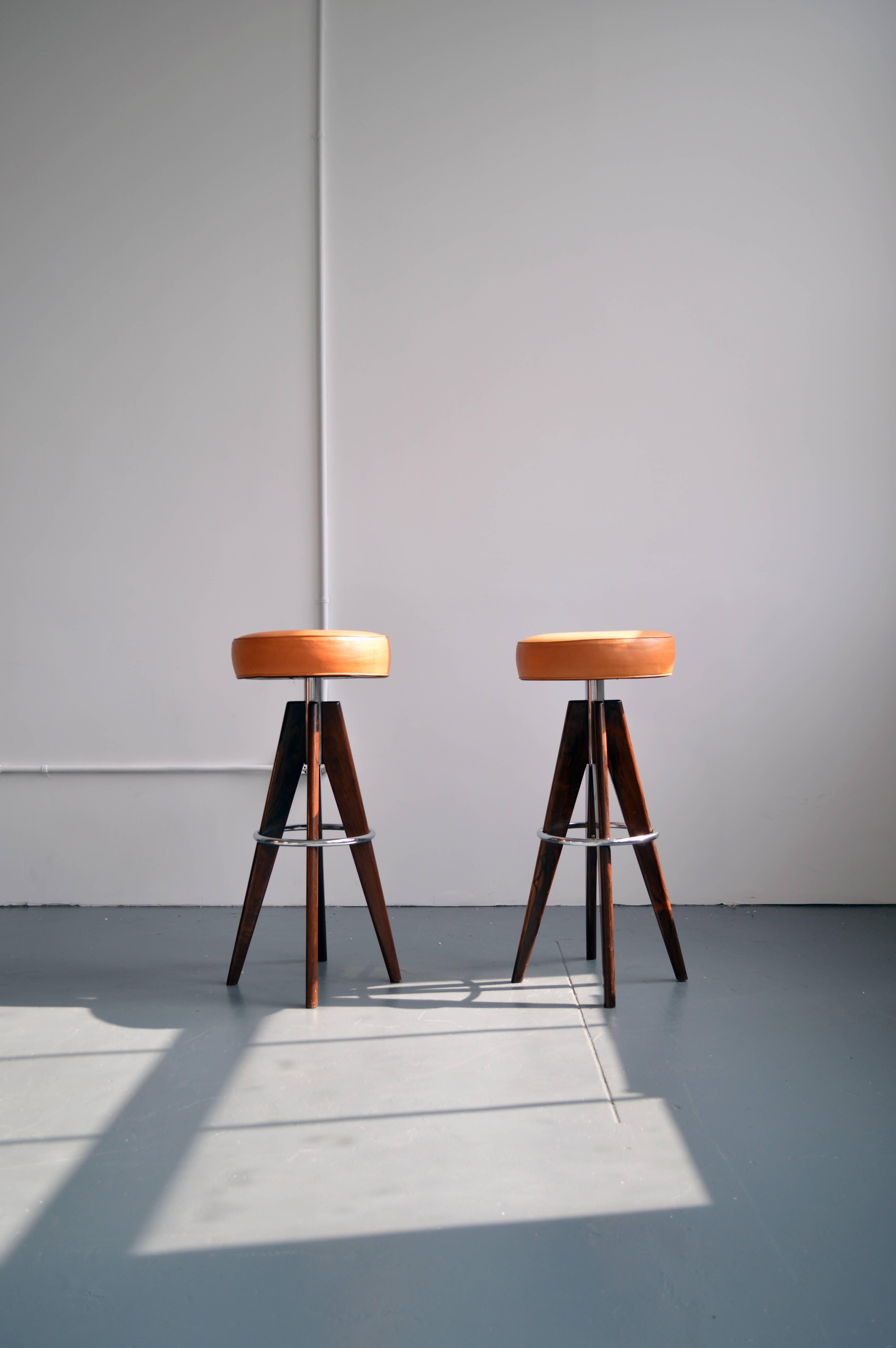 Beautiful vintage bar stools with swivel seats designed by Arne Hovmand-Olsen. Signed with decal manufacturer's label to underside of seat on both.