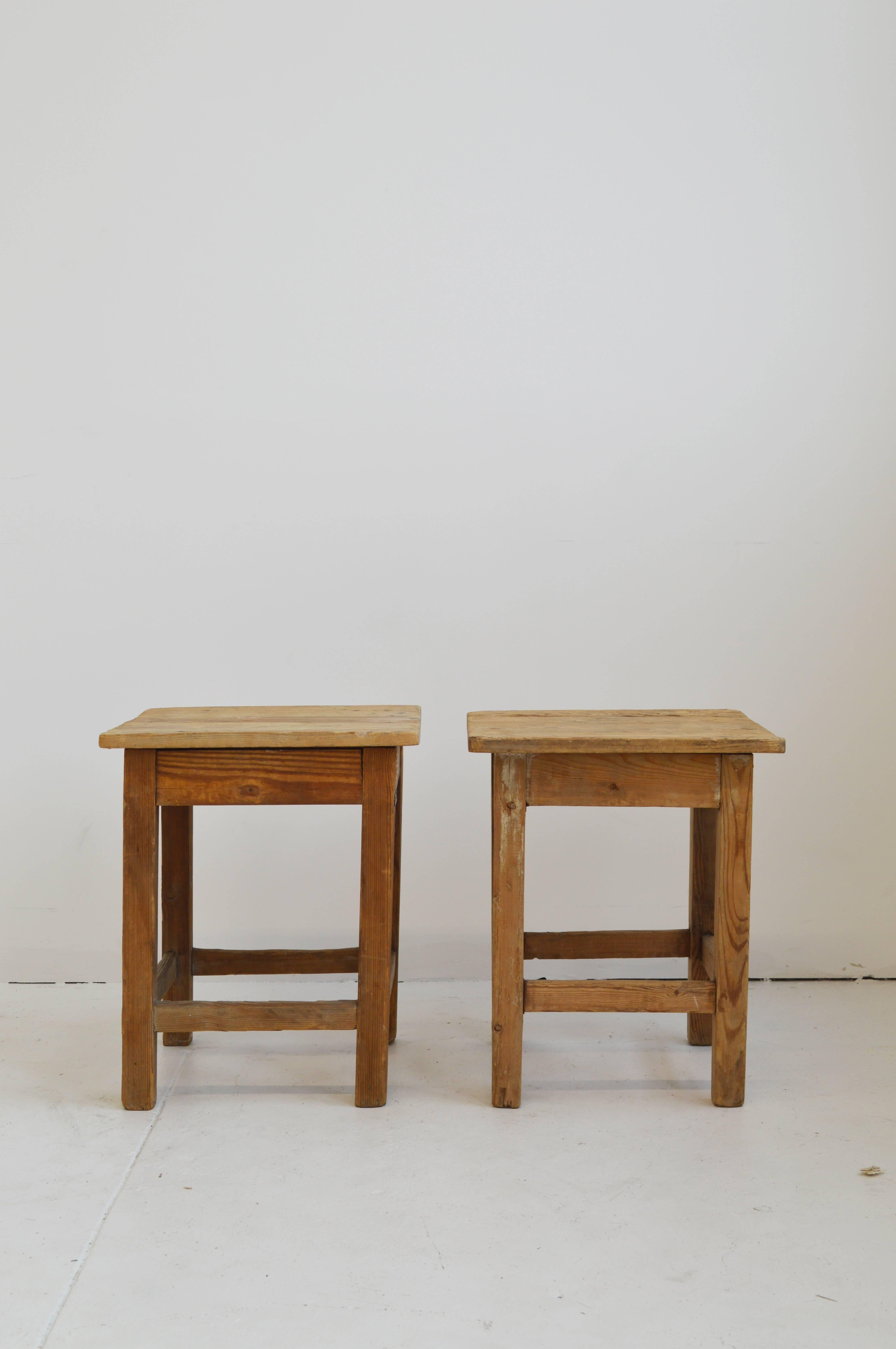 Pair of rustic rectangular wood side tables. Some discoloration and slight losses to wood adding to the rustic appeal of these stools.

Offered by Neal Beckstedt