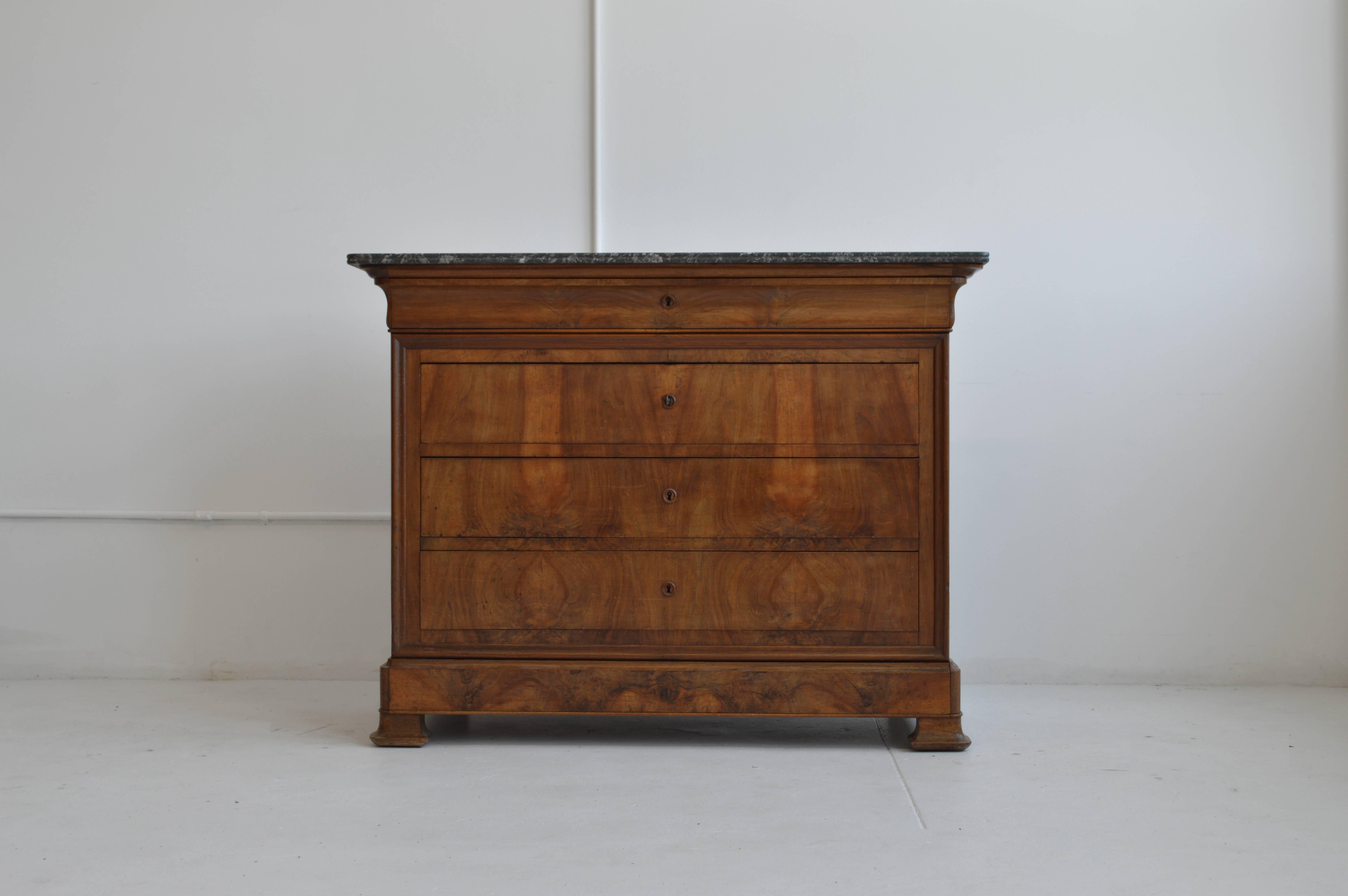 Vintage Louis Philippe period commode with book-matched burl walnut and Saint Anne, double beveled top originally from France. There are five functioning drawers that can be opened by either of two keys, the fifth is shown as a secret drawer on the