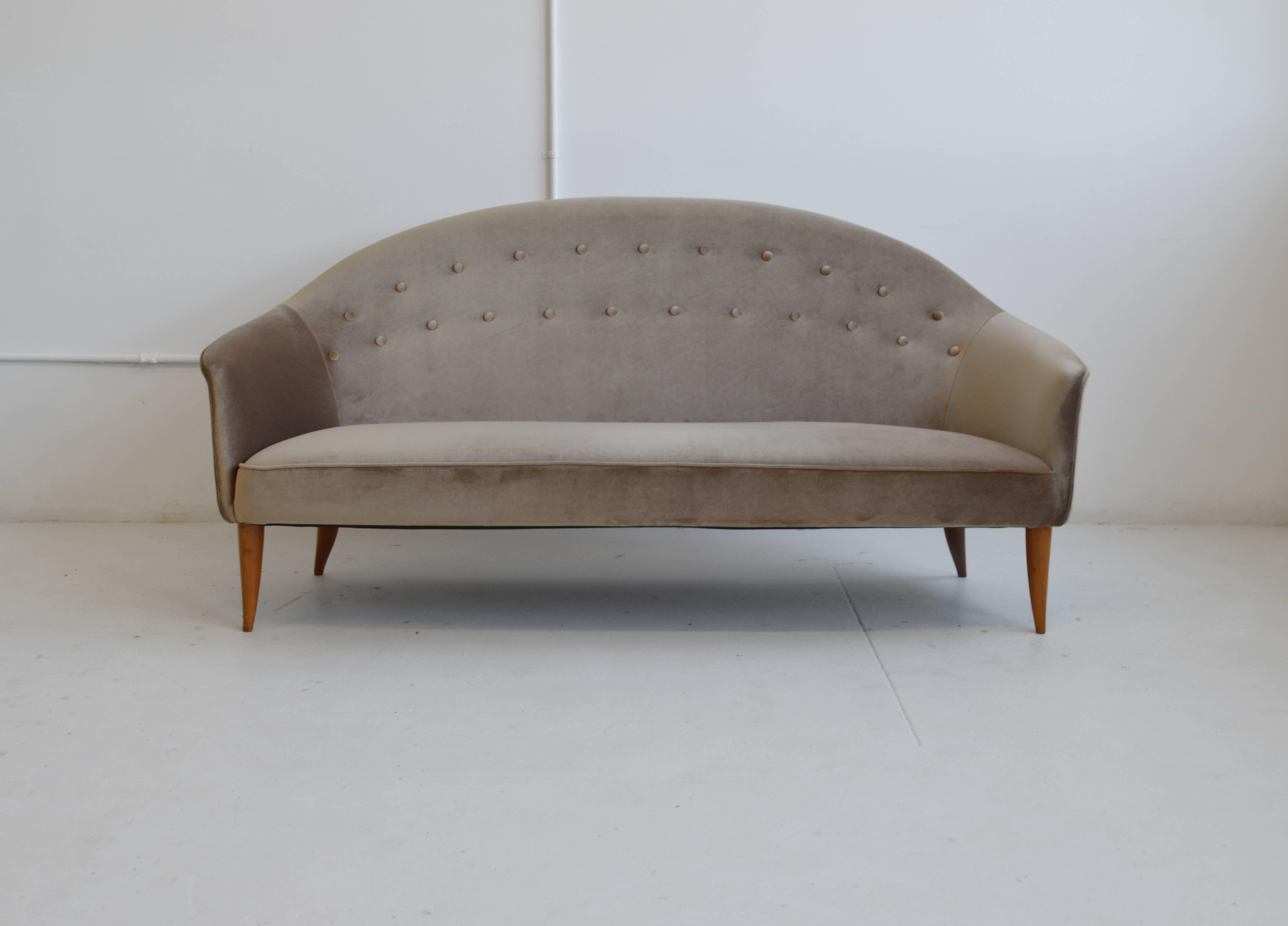 Paradise Sofa by Scandinavian designer Kerstin Hörlin-Holmquist for Nordiska Kompaniets Verkstader. This sophisticated sofa features near flawless velvet upholstery, beech solid wood legs and acts as a wonderful settee. This sofa would make an