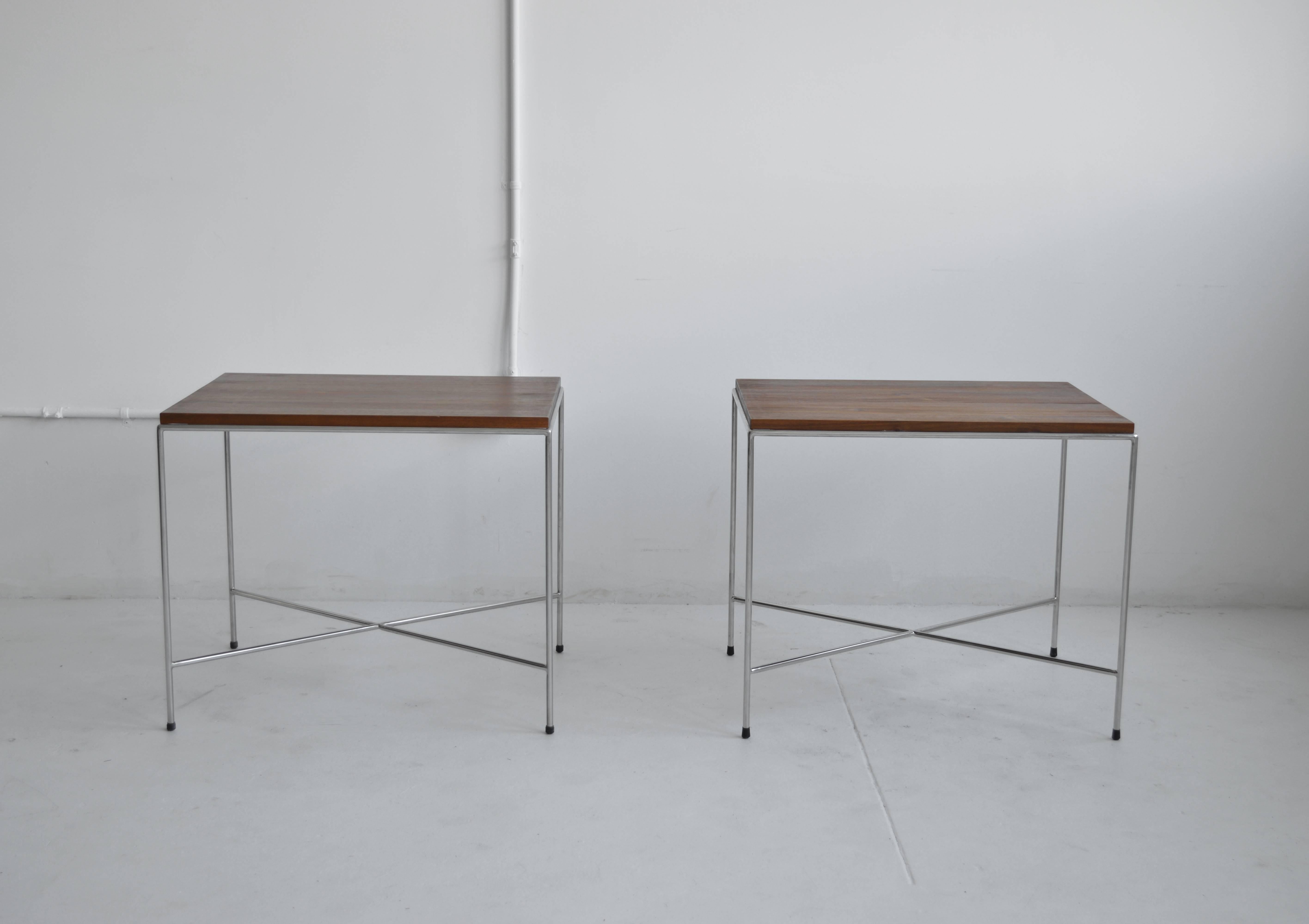 Pair of X-base side tables from Established Lines. These side or end tables are made out of solid stainless steel rods and have a 3/4