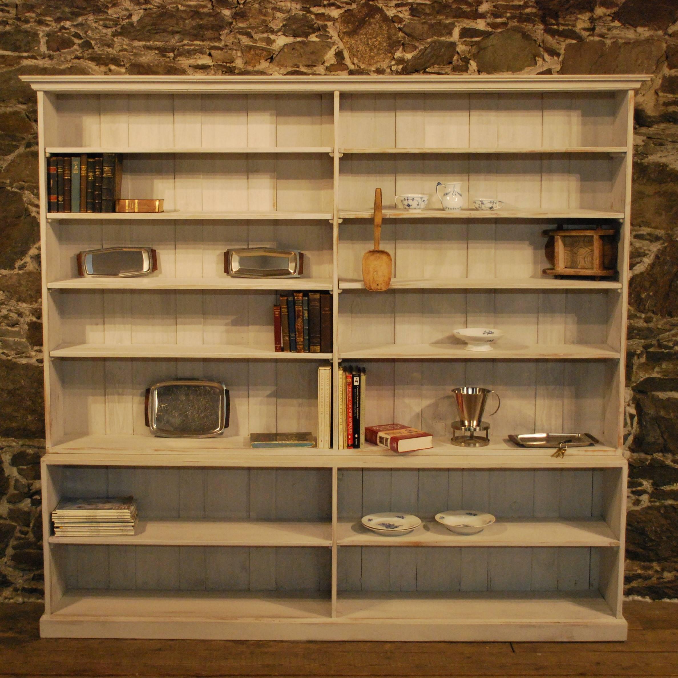 An early 20th century store display painted in the Gustavian style with some replaced moldings and shelves. A strong, solid open shelf for home or business only 14