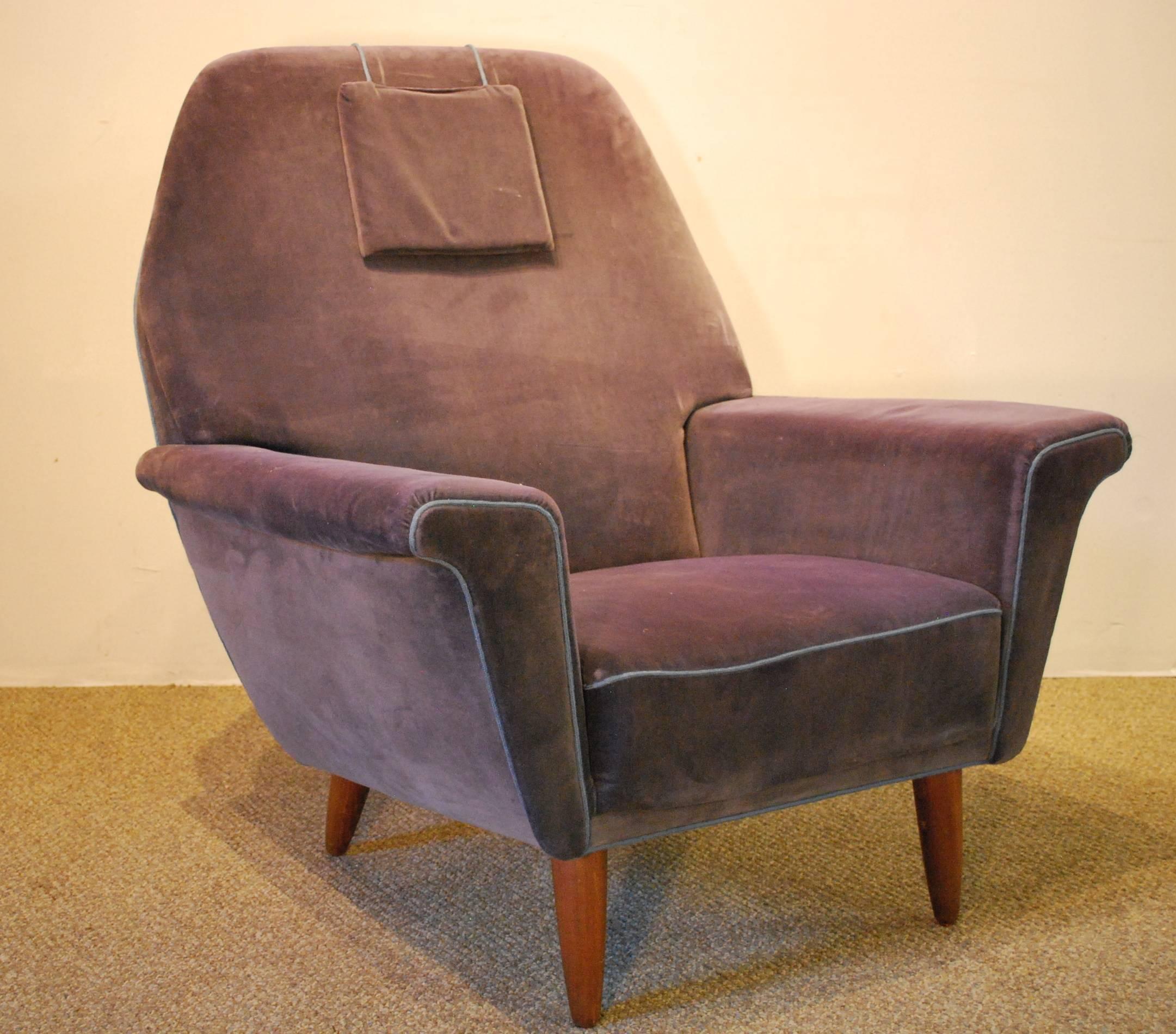 A Danish Mid-Century Modern wingback armchair upholstered in a soft gray/blue velvet fabric with matching piping and an attached head pillow. This stylish chair is a partner to the matching sofa with the same classic Scandinavian design lines.