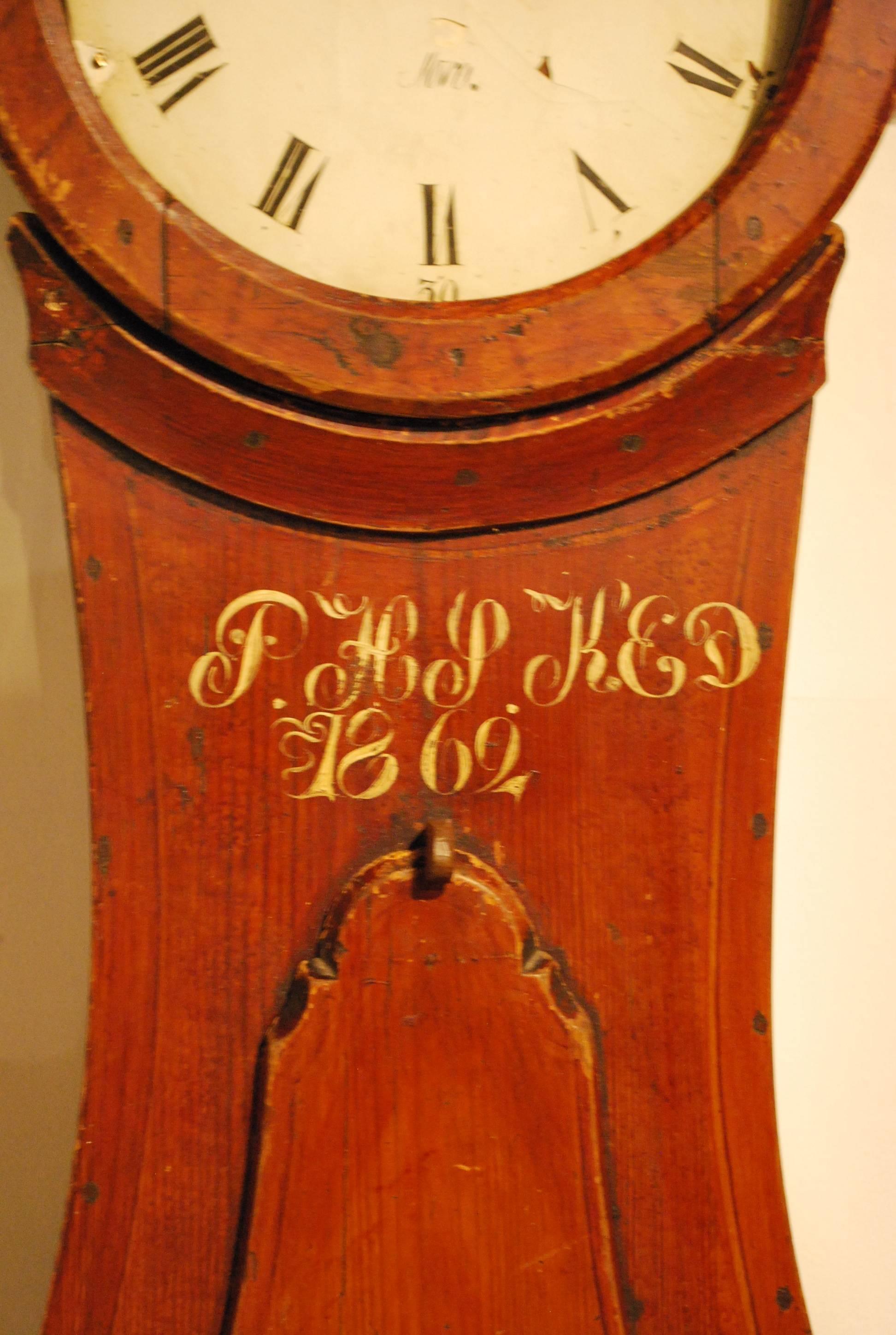 An unusual untouched Swedish Mora wedding clock in original condition. This is one of the rare Mora clock that was never over painted or 'update' over the last 154 years. Note the original pegs, lack of glass and the loss of original paint is