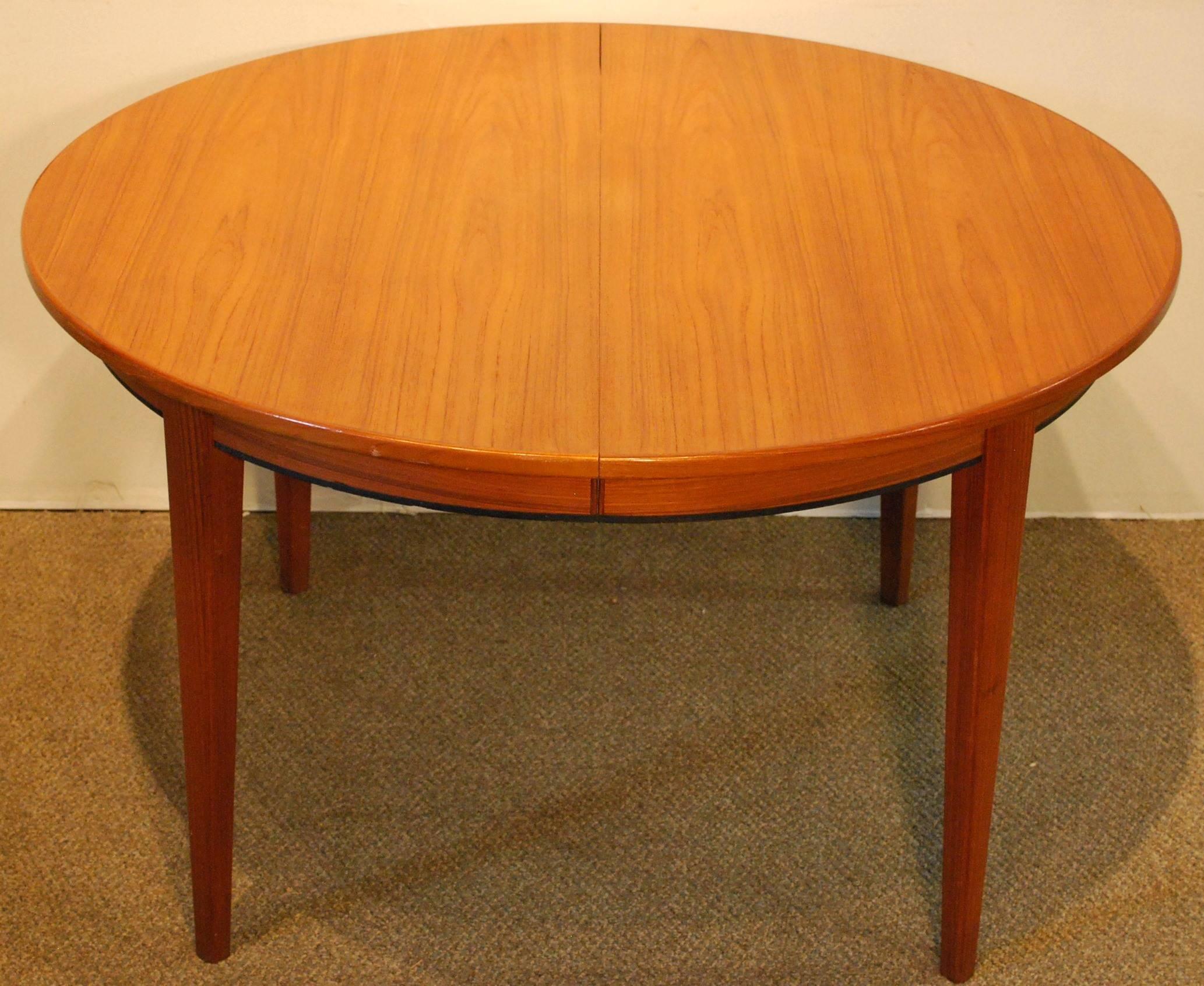 Scandinavian Modern Gunni Omann Designed Mid-Century Teak Table with Three Leaves, circa 1960 For Sale