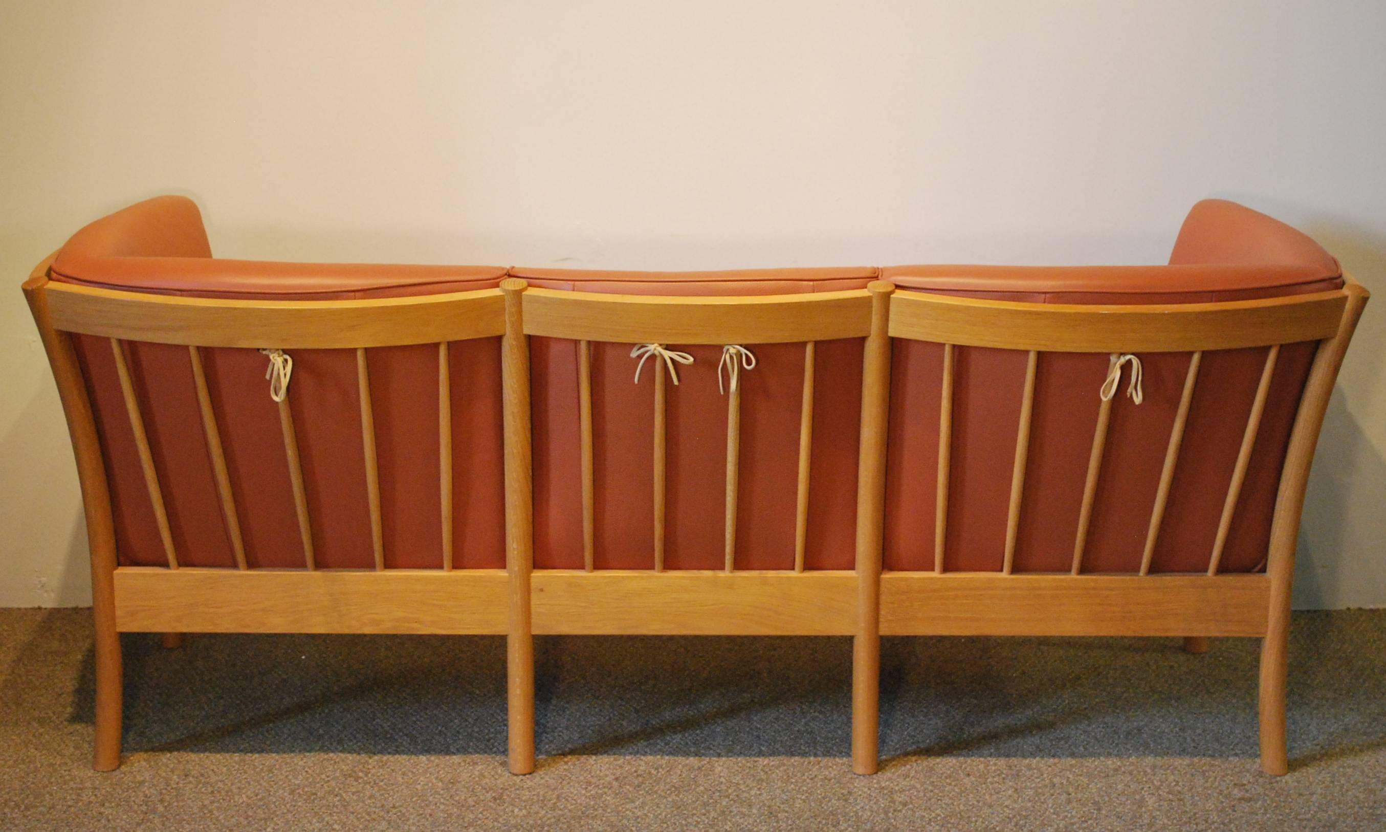 Scandinavian Modern Danish Modern Leather Sofa by Hurup with a Shaped Oak Frame For Sale