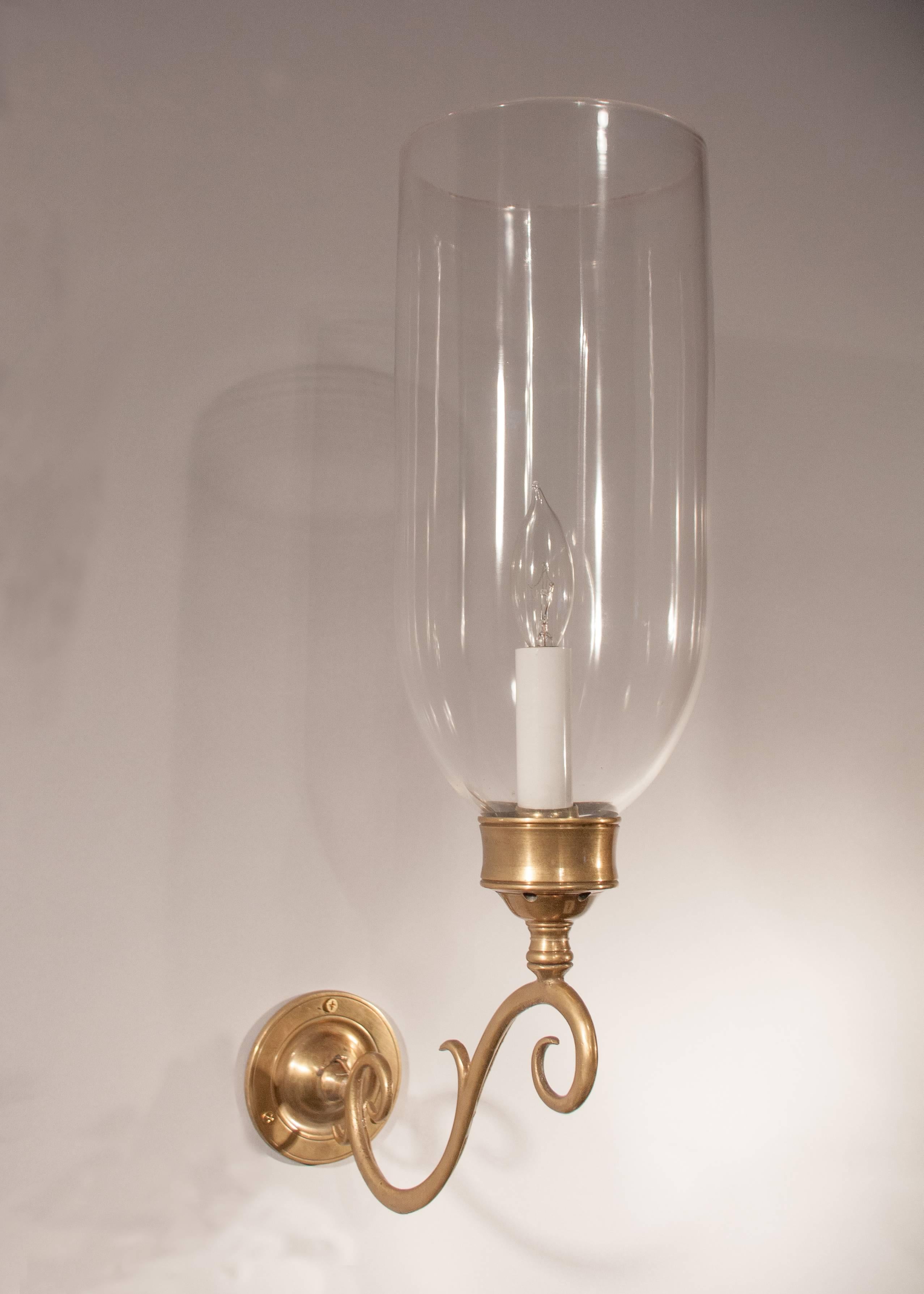 Pair of English hand blown glass hurricane sconce shades, circa 1870. Small air bubbles in the glass reflect the quality and age of the shades. The sconces have been newly French wired to accommodate a single candelabra bulb up to 60 watts. Custom