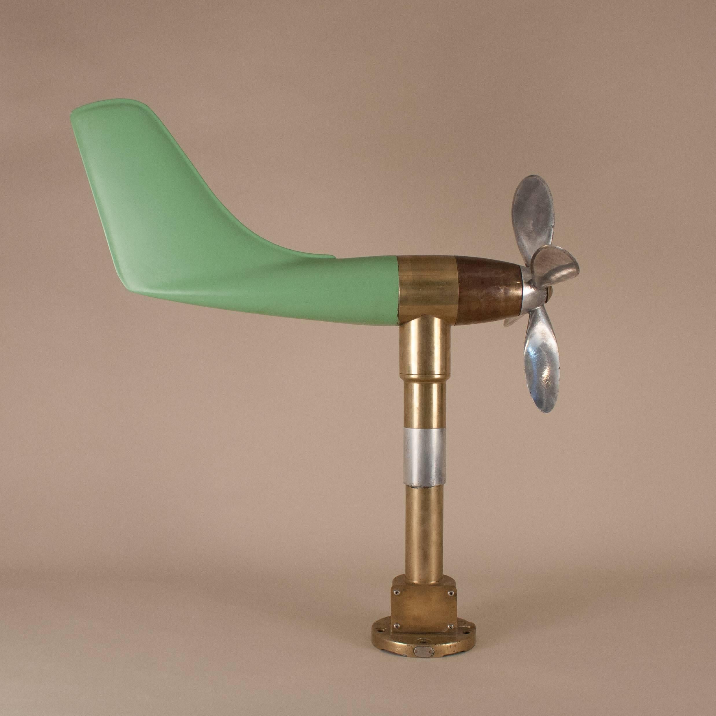 This vintage anemometer, originally wired and used to measure wind speed and direction on an airfield or ship, now makes a delightful Kinetic sculpture. Whether wind- or manually-driven, the aluminum propeller, brass shaft and re-painted fiberglass