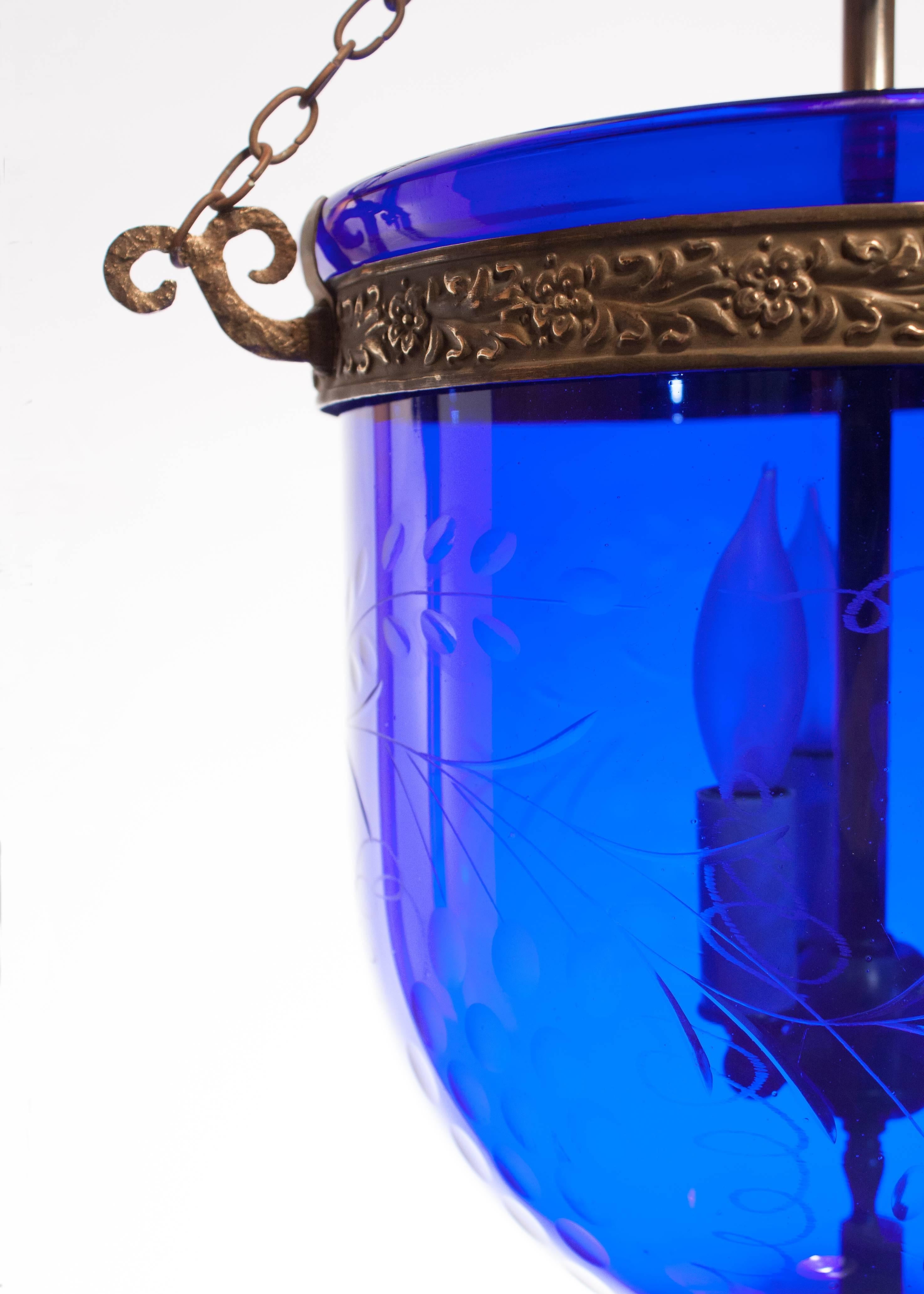 The deep cobalt color, flawless form and finely etched grape leaf design make this lantern a rare gem in Fair Trade's bell jar collection. Handblown in England by S&C Bishop & Co., circa 1890, the Bishop name is discretely marked on the glass and