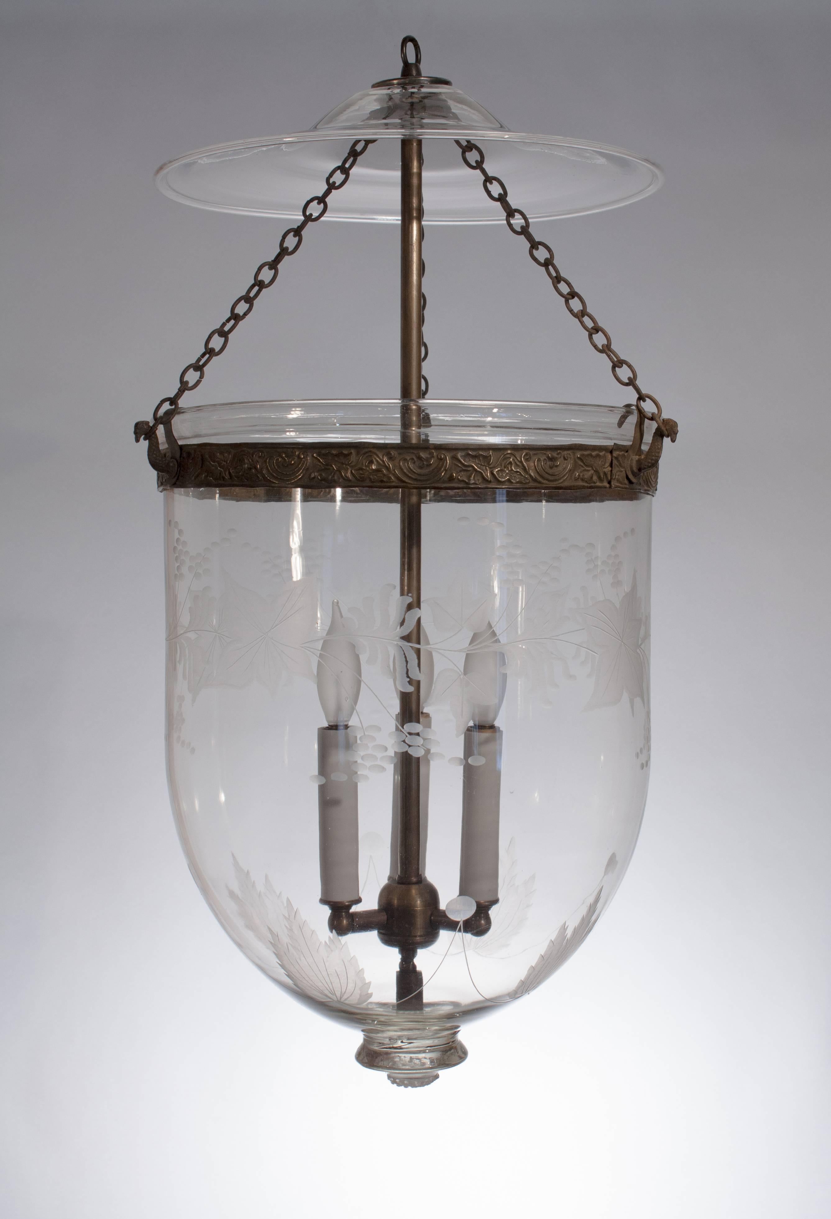 From our private collection, everything about this 19th century English handblown glass bell jar hall lantern is exceptional. Generously sized and classic in form, the bell jar features authentic brass fittings—including its pressed collar band and