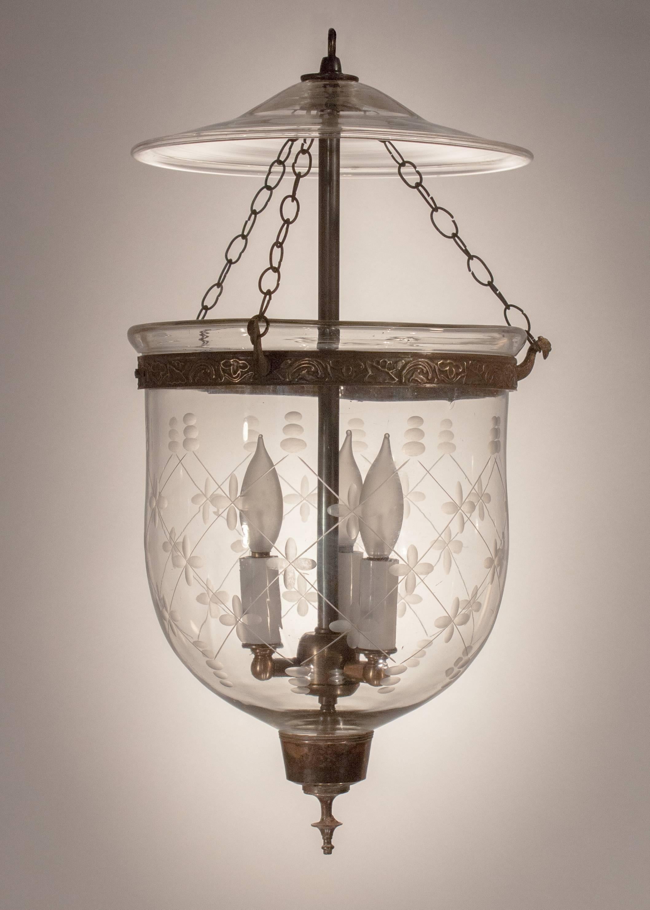Classic English bell jar lantern, circa 1860, with lovely proportions and a complementary etched trellis pattern. The handblown glass is Fine quality, with desirable swirls and air bubbles. The hall lantern has its original smoke bell and unadorned