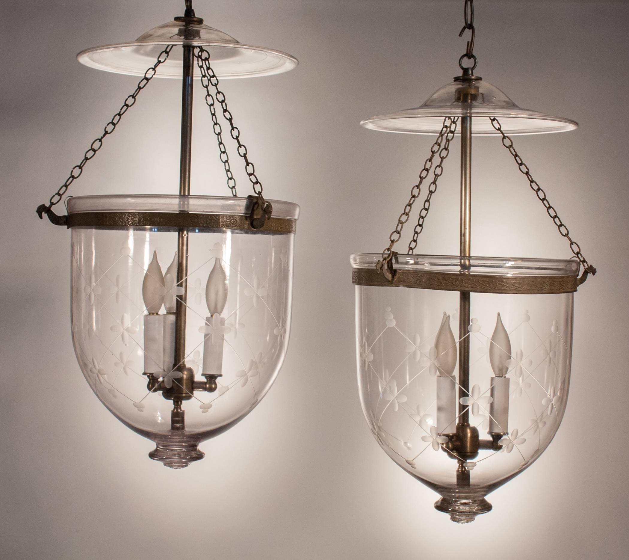 Pair of shapely, medium-sized hand blown glass bell jar hall lanterns with etched 