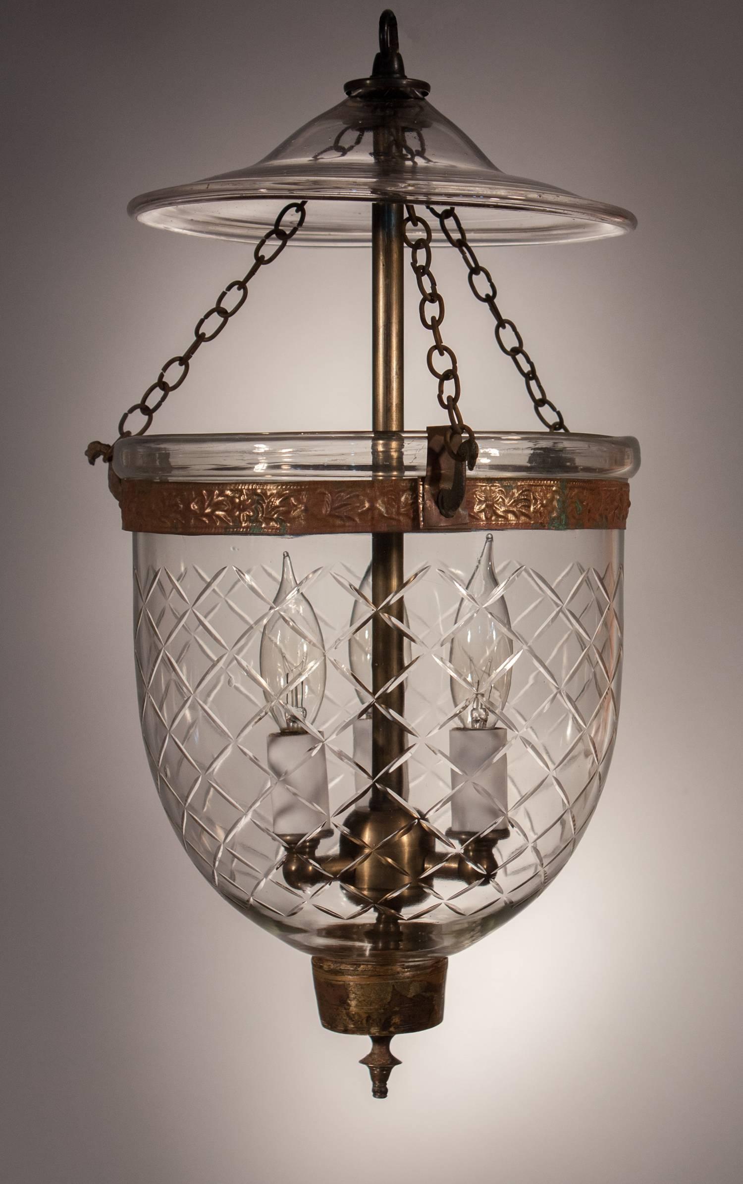 Charming handblown glass bell jar lantern from England with an etched diamond motif that suits this petite pendant. This circa 1860 hall lantern has its authentic brass fittings, including embossed band and candle holder finial. The light has been