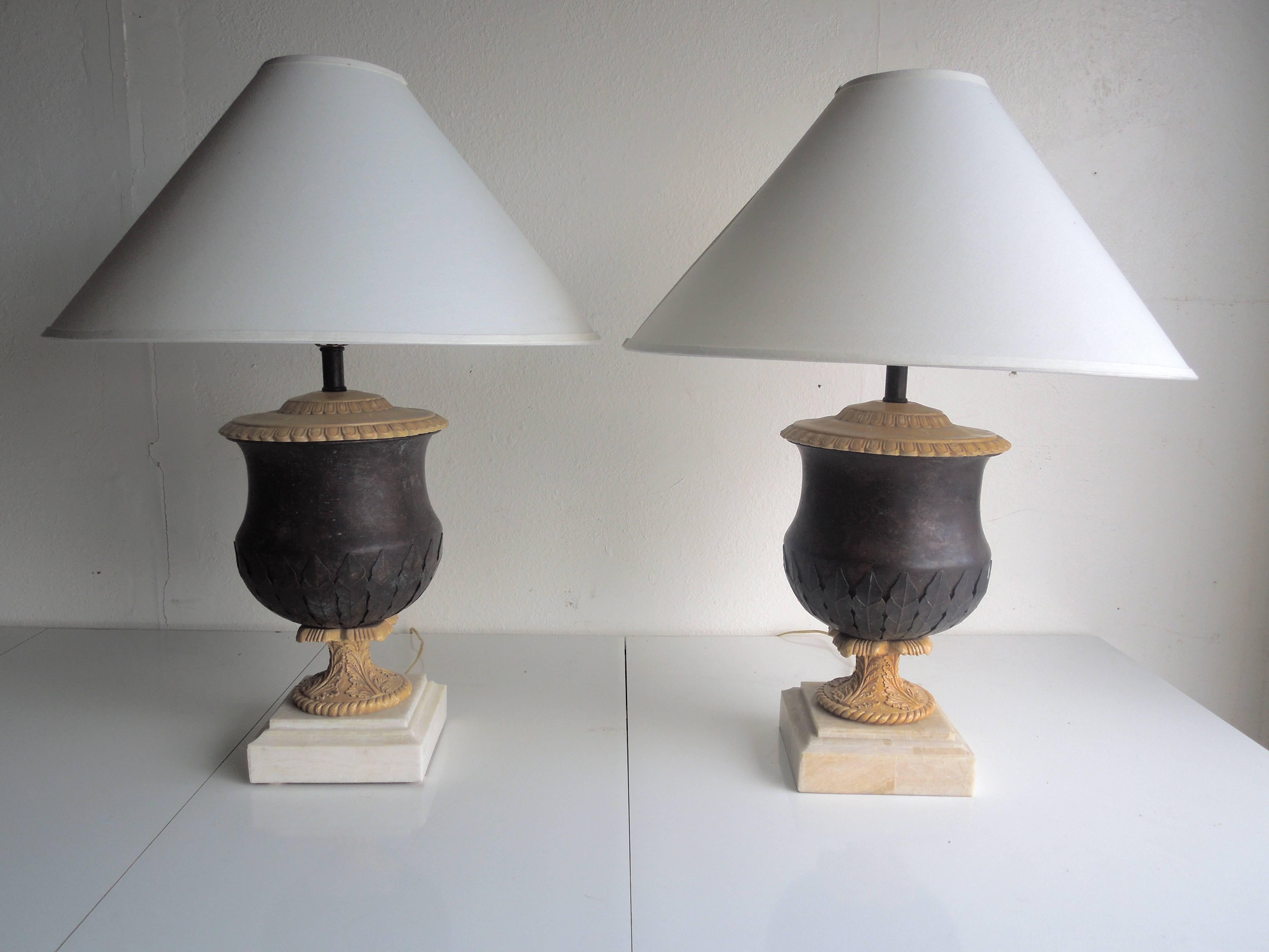 From a very special Palm Springs estate entirely designed by Kreiss in the 1980s, a pair of handmade lamps with metal urns that have a leaf design and marble bases. Lamps obtain Kreiss labels, handmade in the Philippines. The hand done patina is a