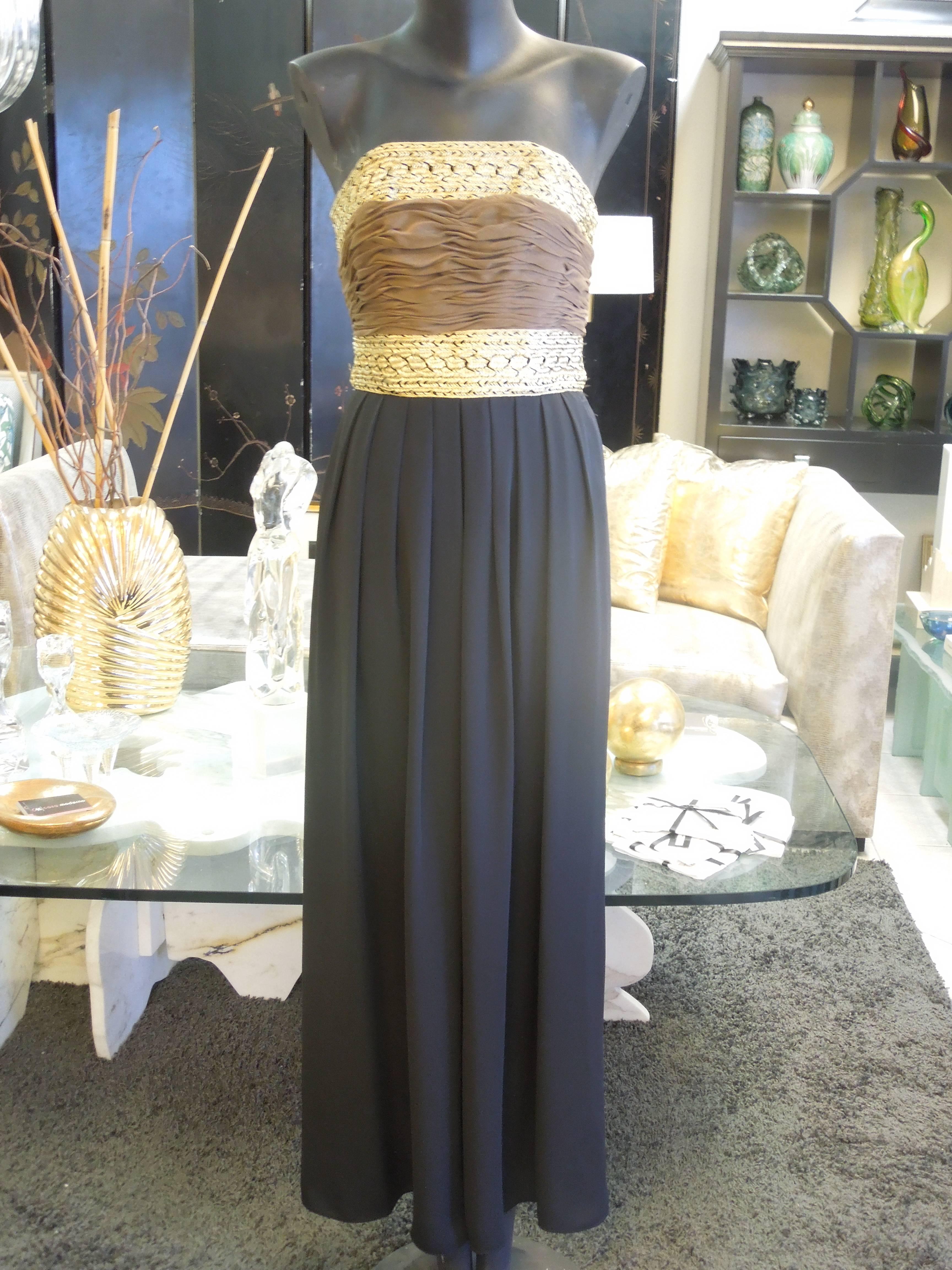It's a beautiful evening ensemble by designer Liancarlo for Saks Fifth Avenue. The staples jumpsuit has a beautiful gold metallic graded bodice with cocoa colored rusted chiffon across the front. Pants are wide pleated black chiffon. Very Chic. To
