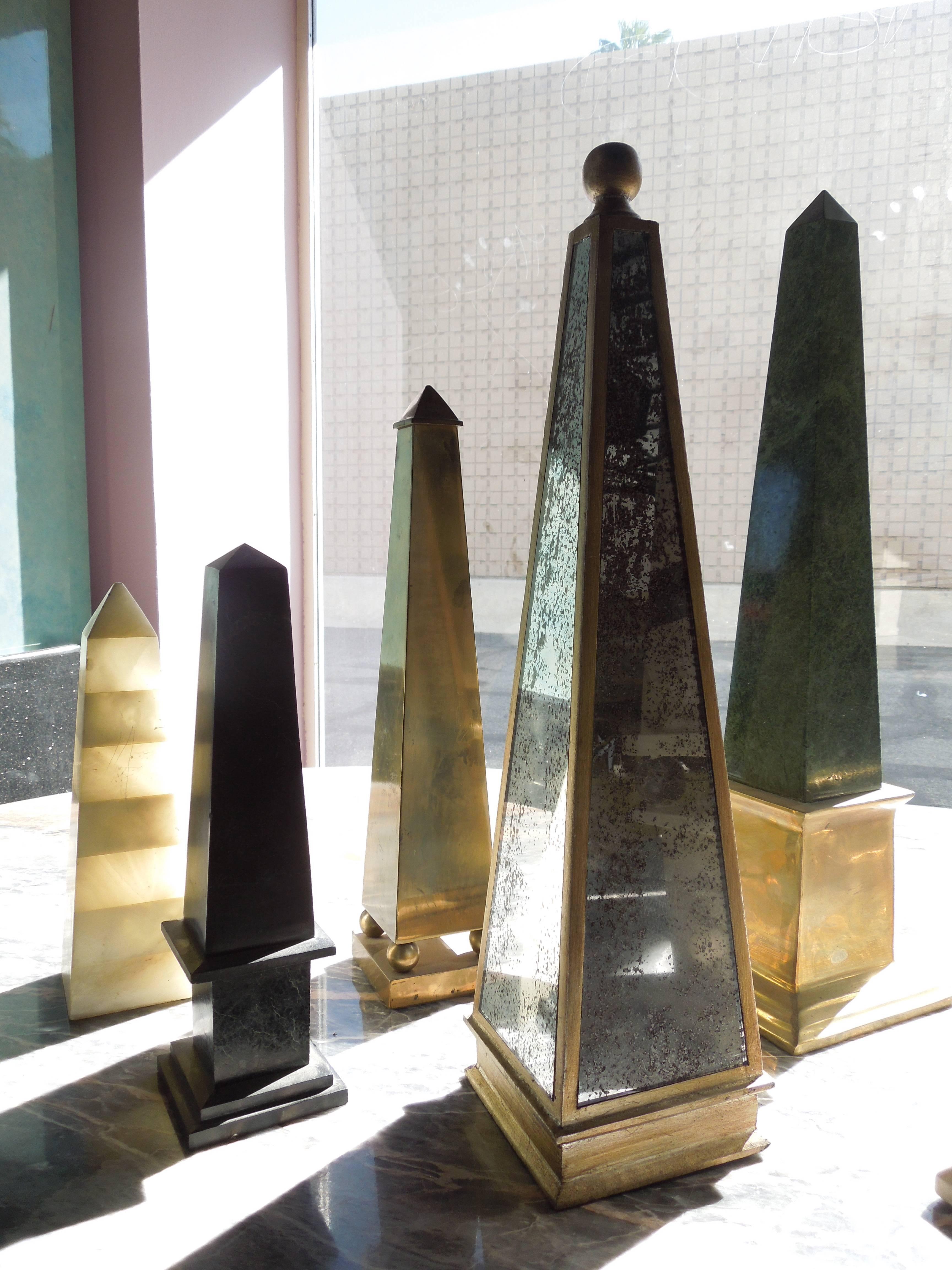 A spectacular collection that took over 25 years to assemble, is a beautiful and special 16-piece group of Obelisks. Made of tesselated stone, brass, marble, and mirror. They range from 11'' H to 30