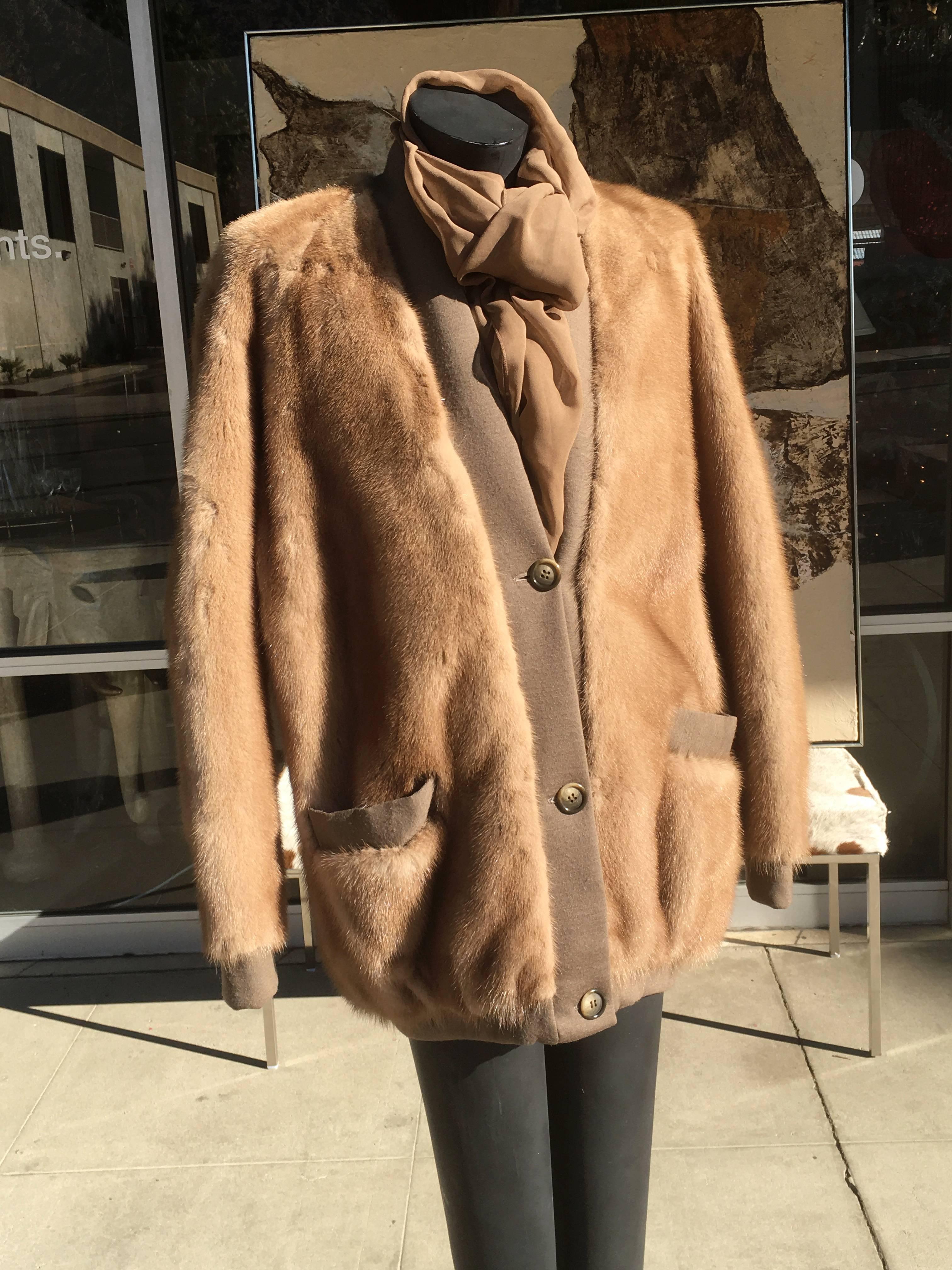 A uber chic mink cardigan jacket from the 1970s. In excellent original condition. This mink jacket, designed by Balmain is as chic and modern as when it was designed. Knit trim on pockets and placket trim. Purchased in I Magnin Beverly Hills. 