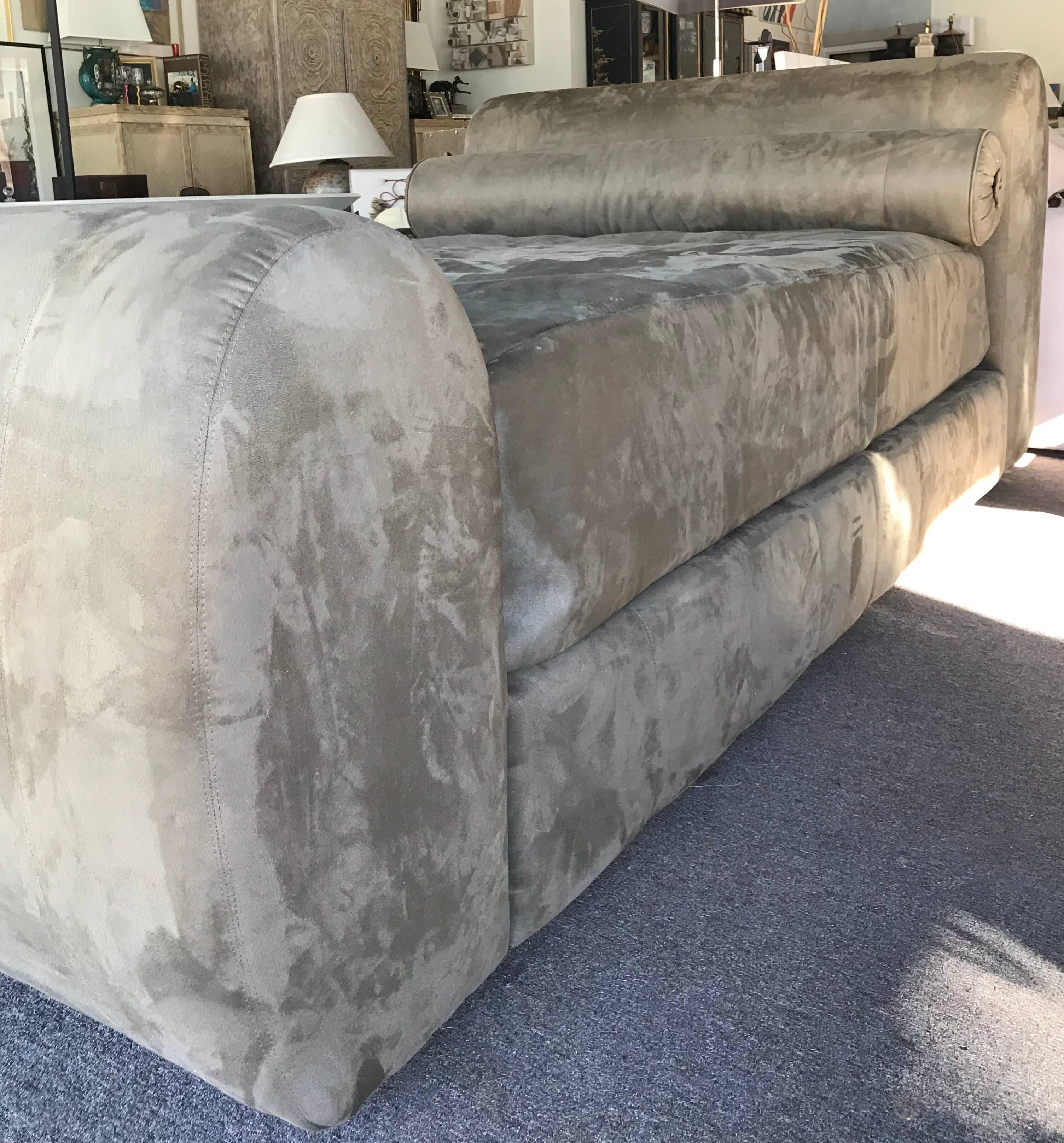 This bed came from a multimillion dollar estate in Tamarisk Country Club in Rancho Mirage, CA. The custom-made queen-size bed is upholstered entirely in a high end elephant color ultra-suede. Bed consists of: headboard, platform, footboard and long
