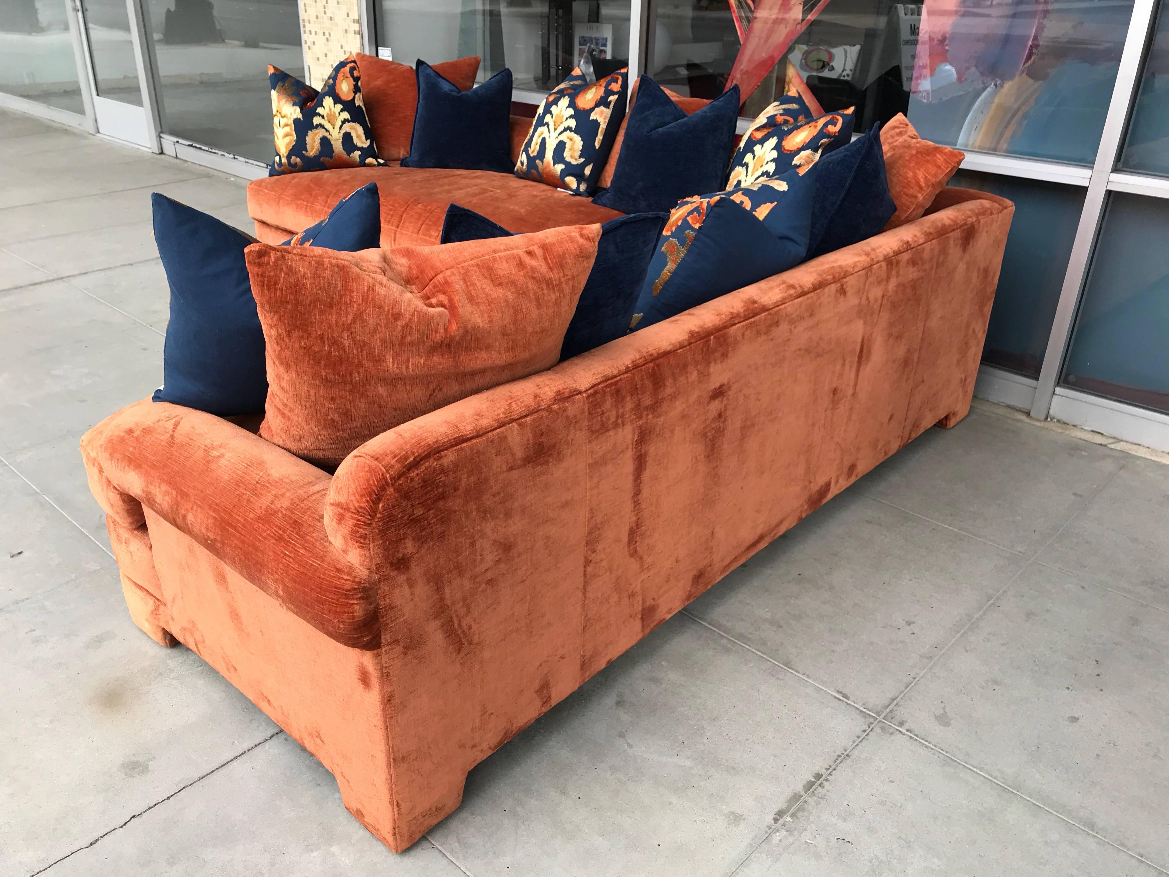 This very beautiful two-piece sectional was owned by a prominent gallery owner in Palm Springs. The entire residence had custom furniture, including this Marge Carson Sectional in antique burnt velvet. The sofa includes 9 designer accent pillows and
