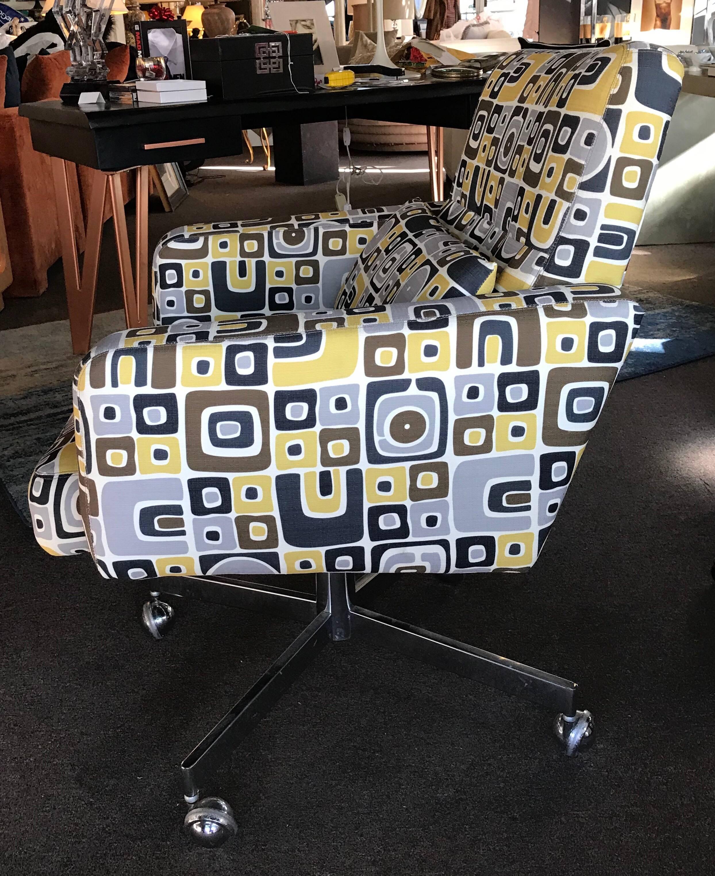A very modern, 1970s modern executive desk chair recently upholstered in a high end modern Pop Art print in grey, black, brown and gold. Original chrome base with casters. Lumbar pillow (detached) as on original chair. Chair came from a Palm Springs